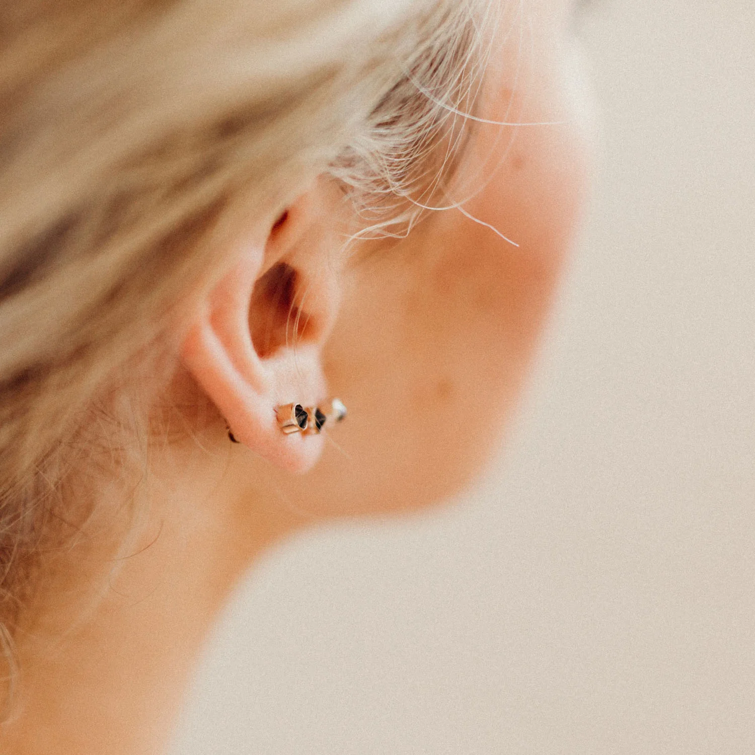Faceted black spinel stones are set upside down, so they form spikes of stone in a simple bezel setting. These posts strike the perfect balance between simple and edgy.
