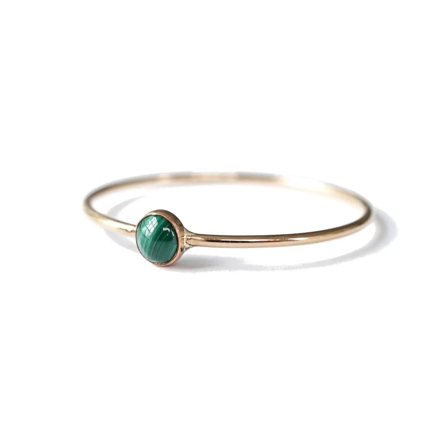 A tiny green-striped malachite gemstone is set on a thin, smooth band. Playful yet minimal, these are perfect for stacking up with other rings or wearing solo.