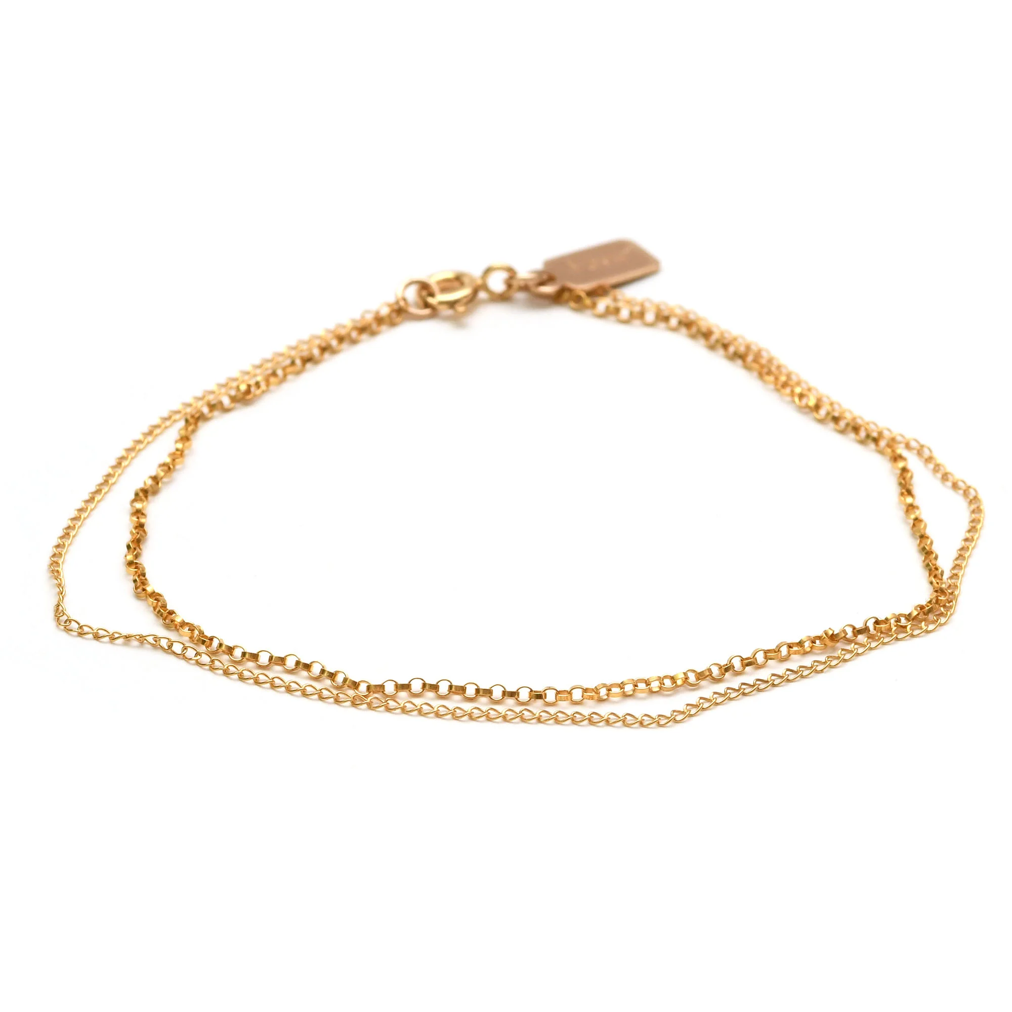 Two chains of different weights and ever-so-slightly different lengths wrap the wrist and gently move as you move.