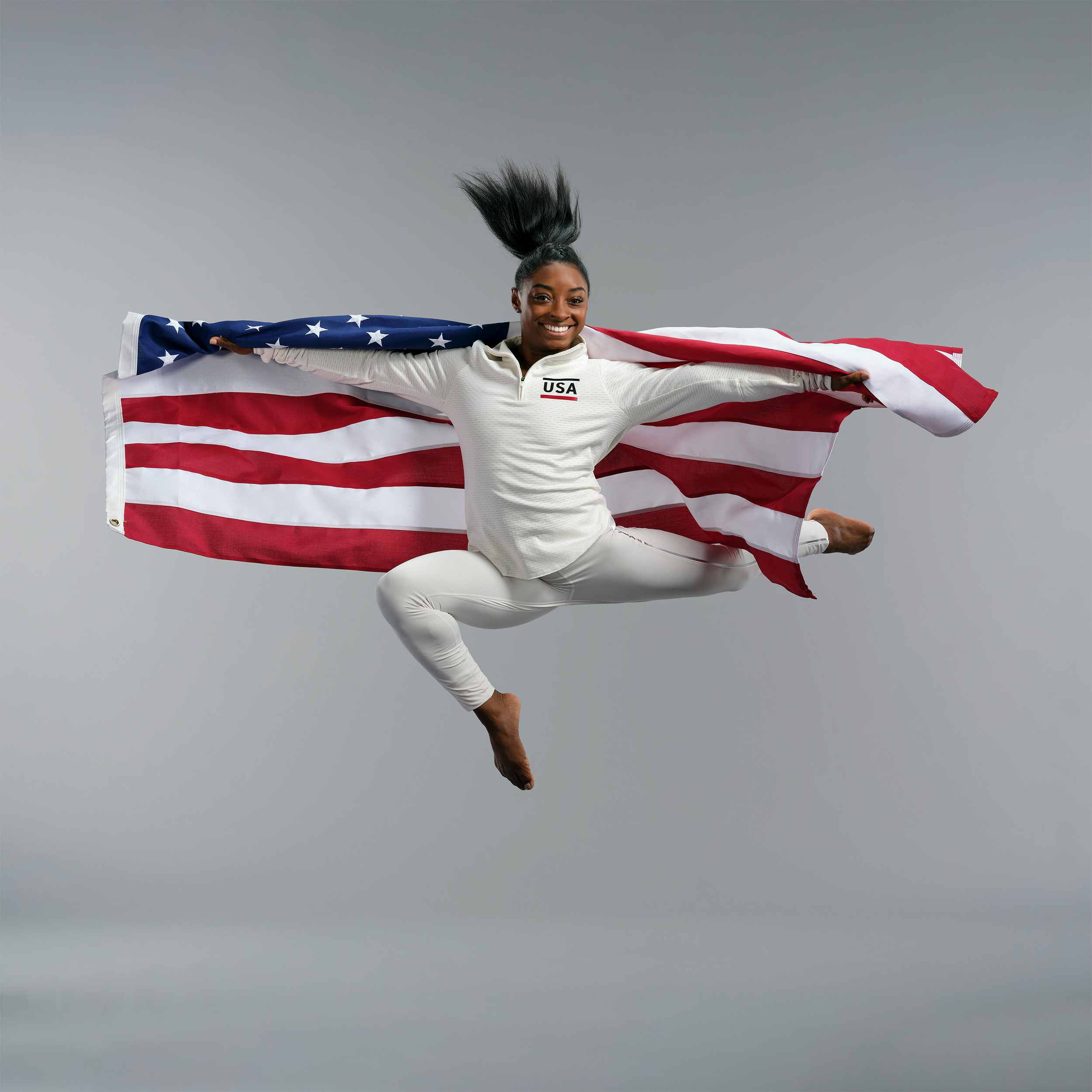VisaOlympicsPromoSimoneBilesFlagFullBodySquareSmaller.png
