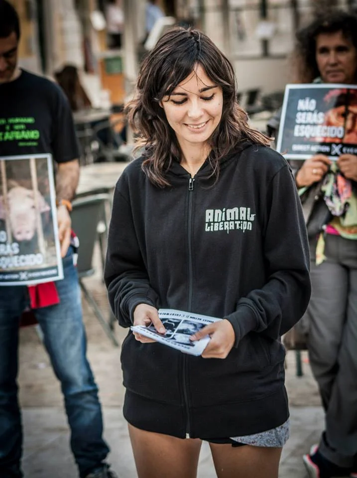 Andreia Carvalho Mota participating in Disrupt Speciesism, DxE's September 2014 Day of Action, in front of a McDonald's in Lisbon, Portugal. 
