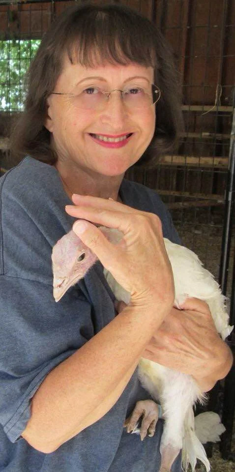 Activist Diane Gandee Sorbi holding a turkey. 