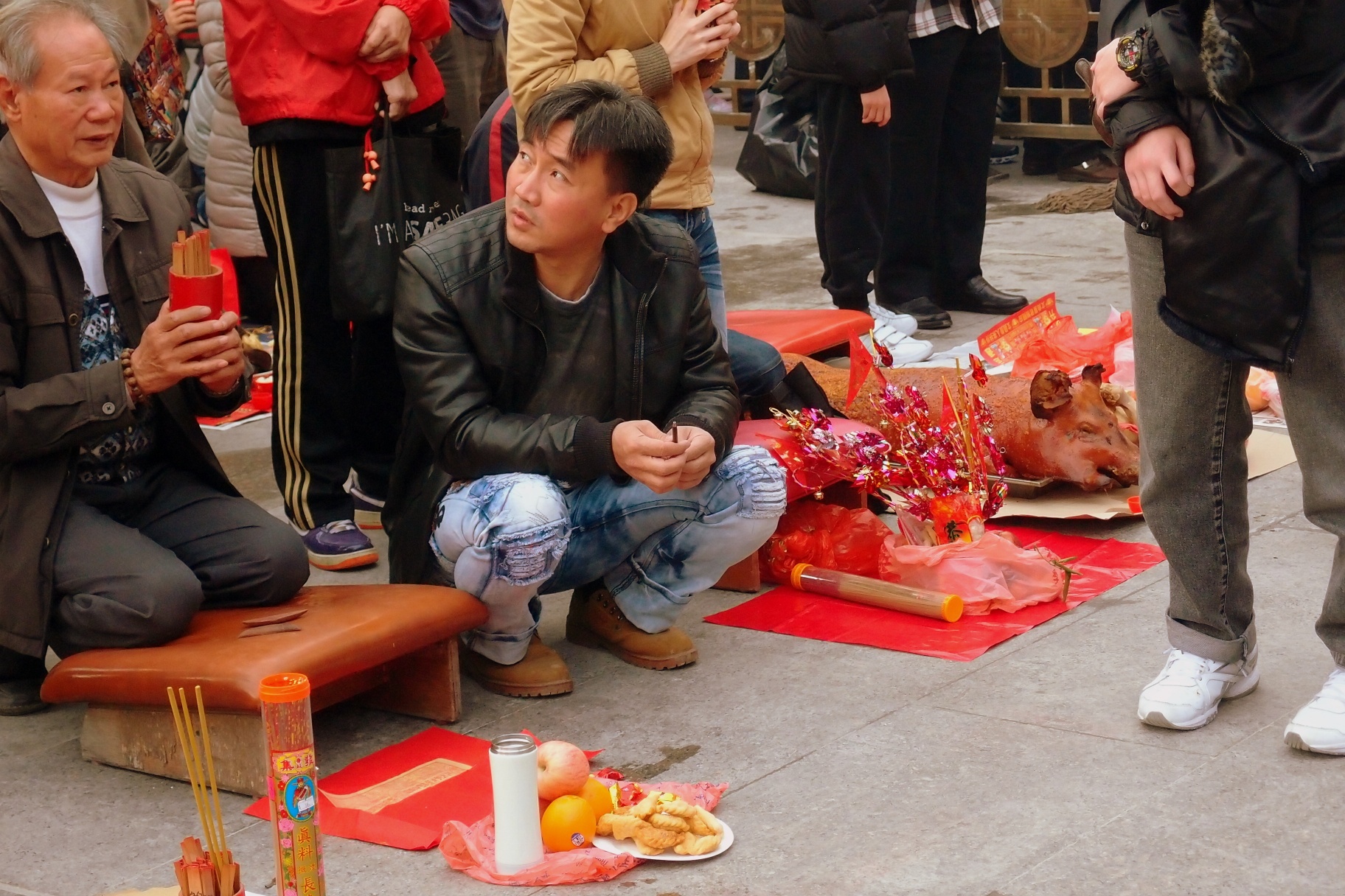 Shaking the chim (fortune sticks) at the Sik Sik Yuen Wong Tai Sin Temple