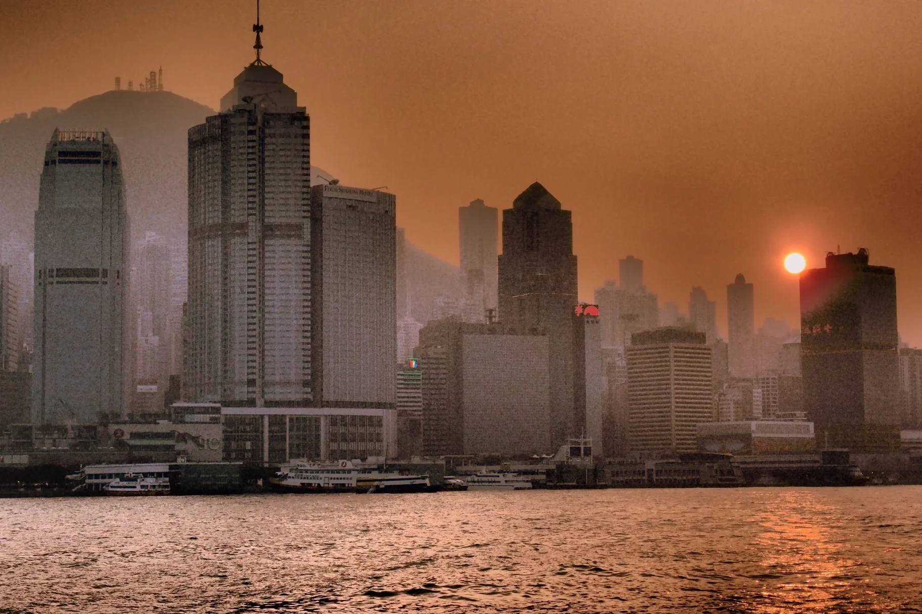 OK... I admit to using a fancy arty setting on the camera but it does not detract from this image of a smoggy winter Hong Kong sunset