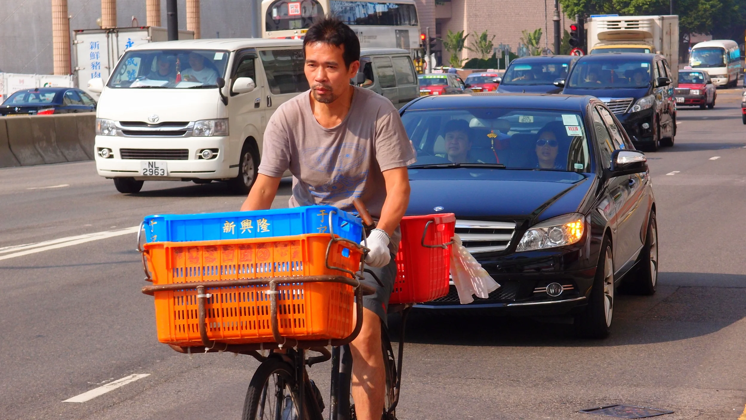 A very brave chap indeed spending his working day weaving in and out of heavy traffic.