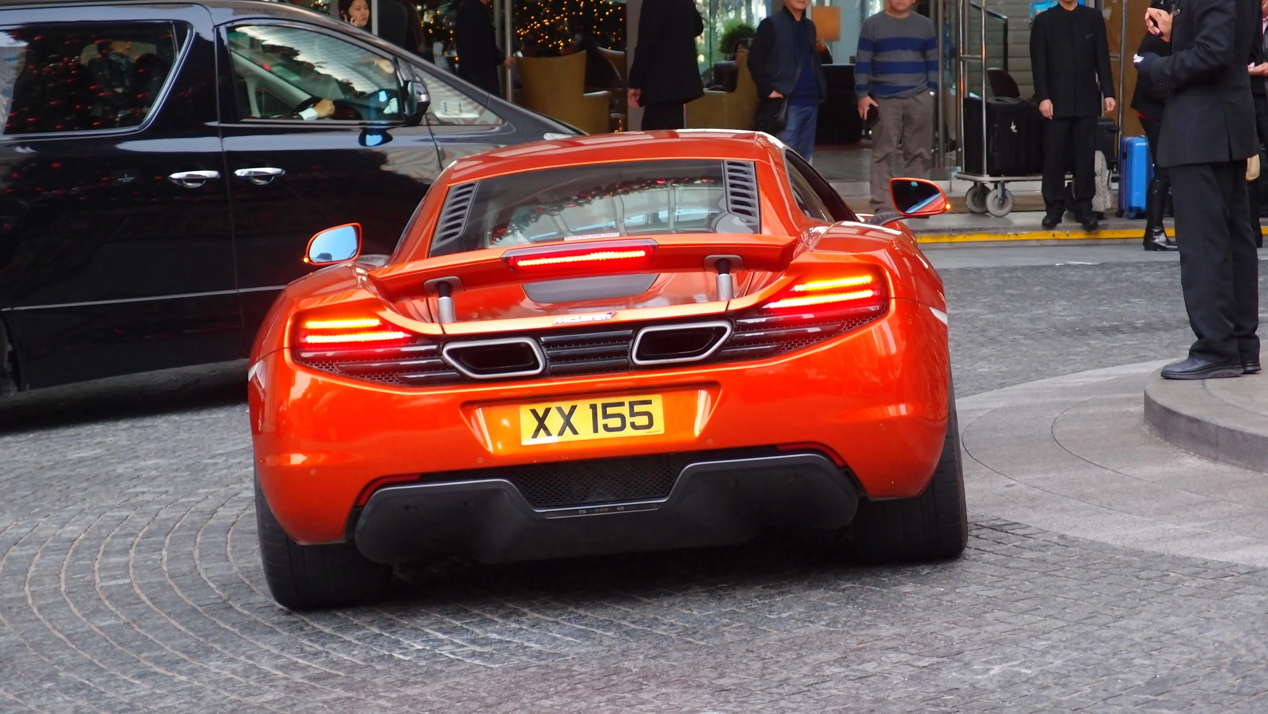 Oh lordy, an orange McLaren at the Four Seasons Hotel in Central