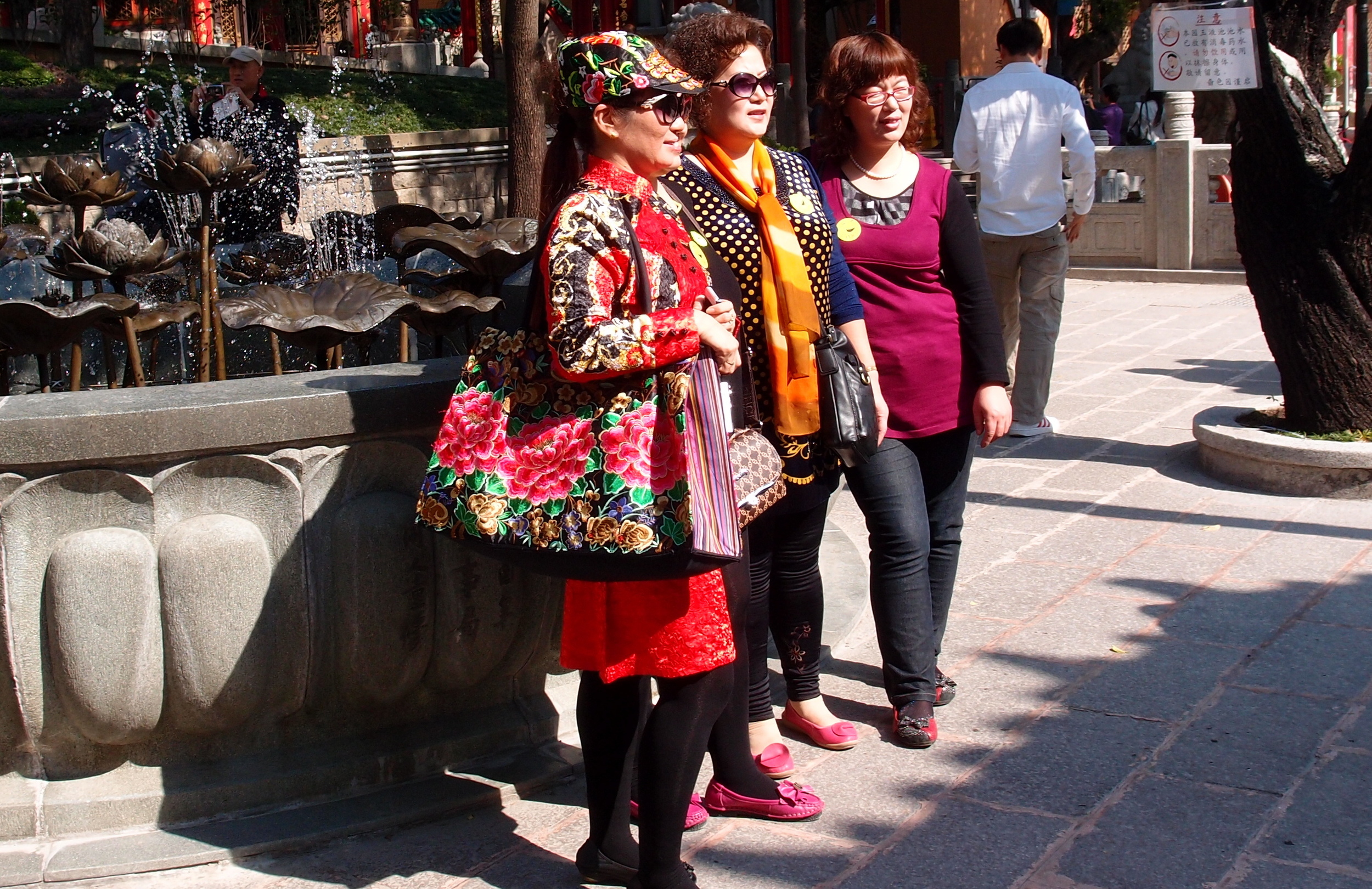 Very colourful Mainland Chinese tourists at the Sik Sik Yuen Wong Tai Sin Temple