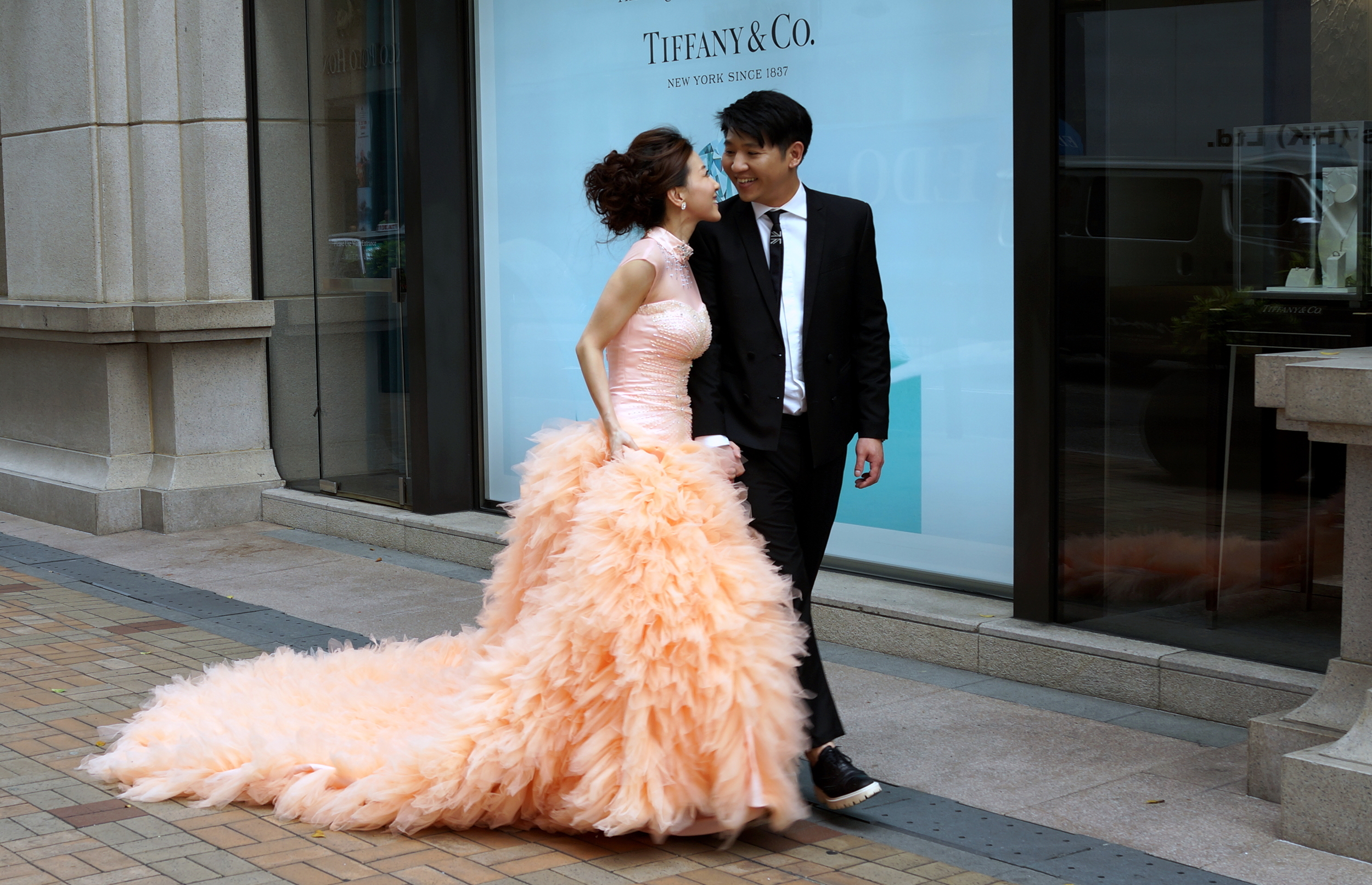 Isn't that just a lovely wedding dress! The pre - wedding photography outside Tiffany at 1881 Heritage in TST, Kowloon