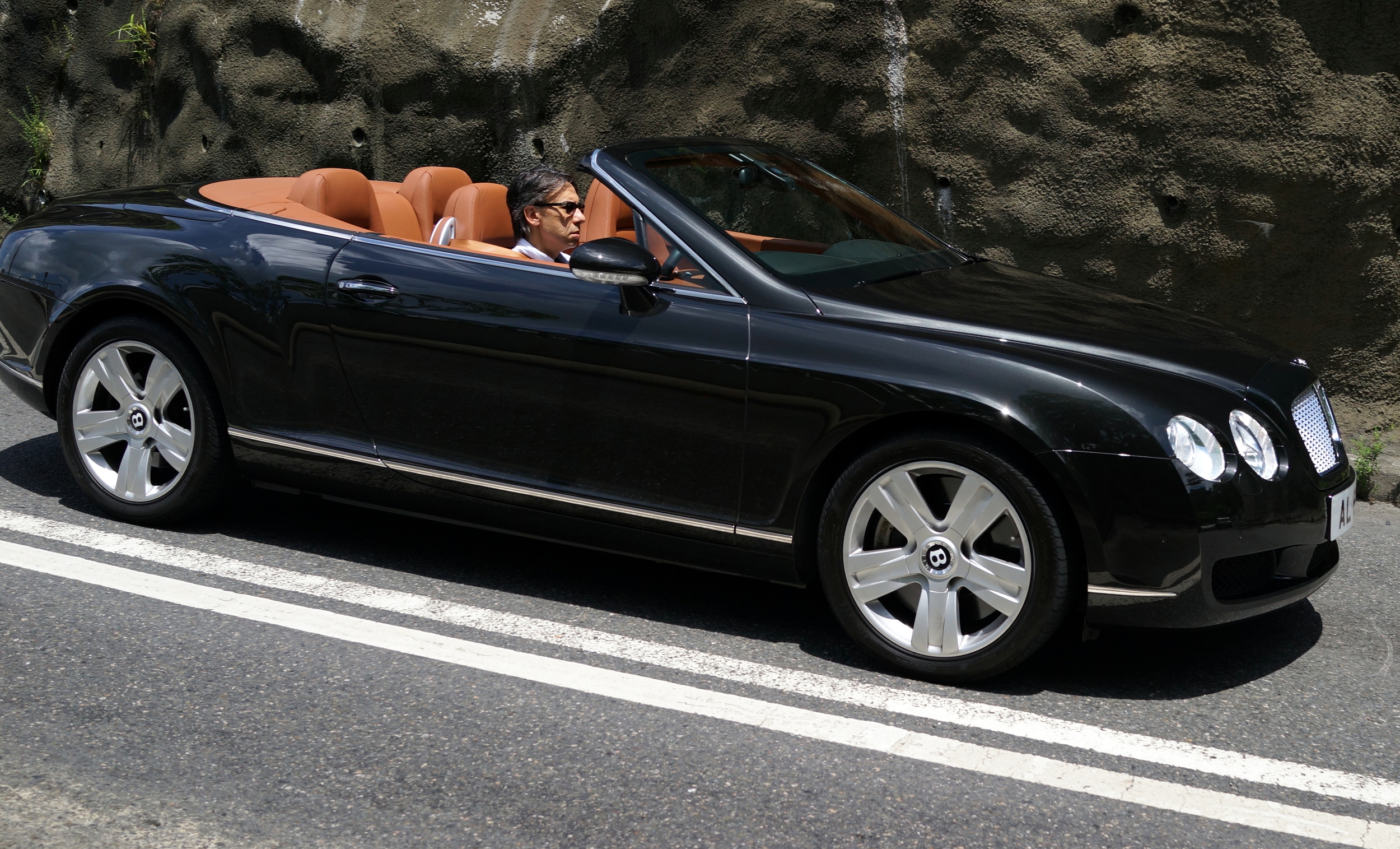 Mid morning on a sunny Sunday zipping through the very scenic Deep Water Bay in a Bentley, I would be grinning from ear to ear... miserable sod!