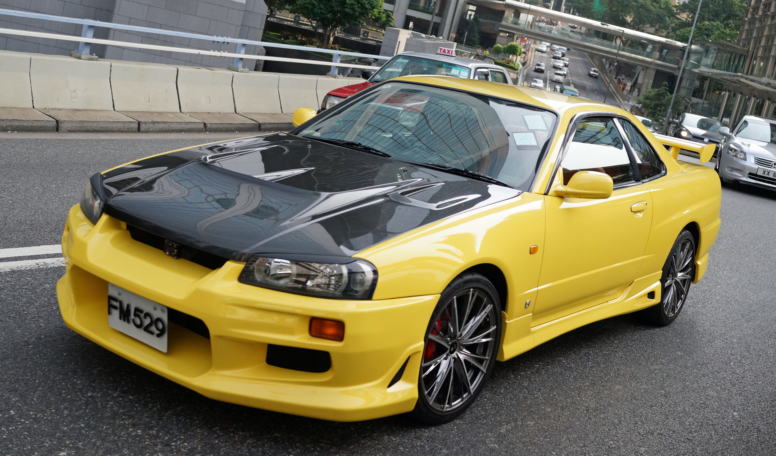Hong Konger's love their cars and this is a very special Hong Kong car - the older version of the brilliant Nissan GTR which is a Porsche / Ferrari killer! lovely...