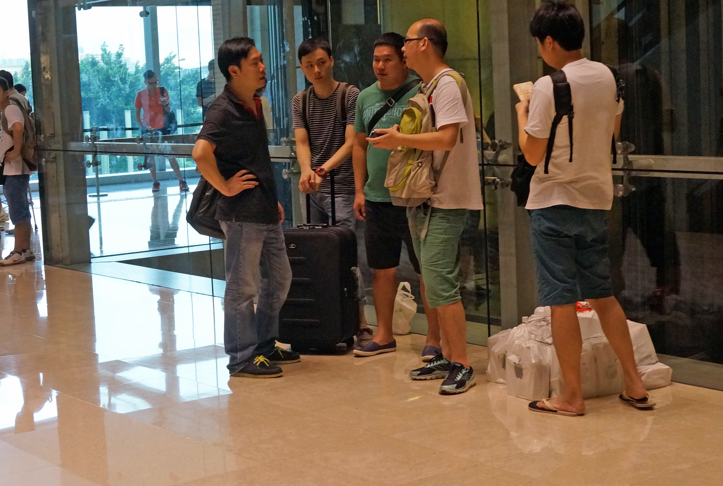 Then I spot what is really going on - people collecting phones they ordered online and then reselling them to traders at a huge profit who then sell them to desperate buyers from Mainland China!