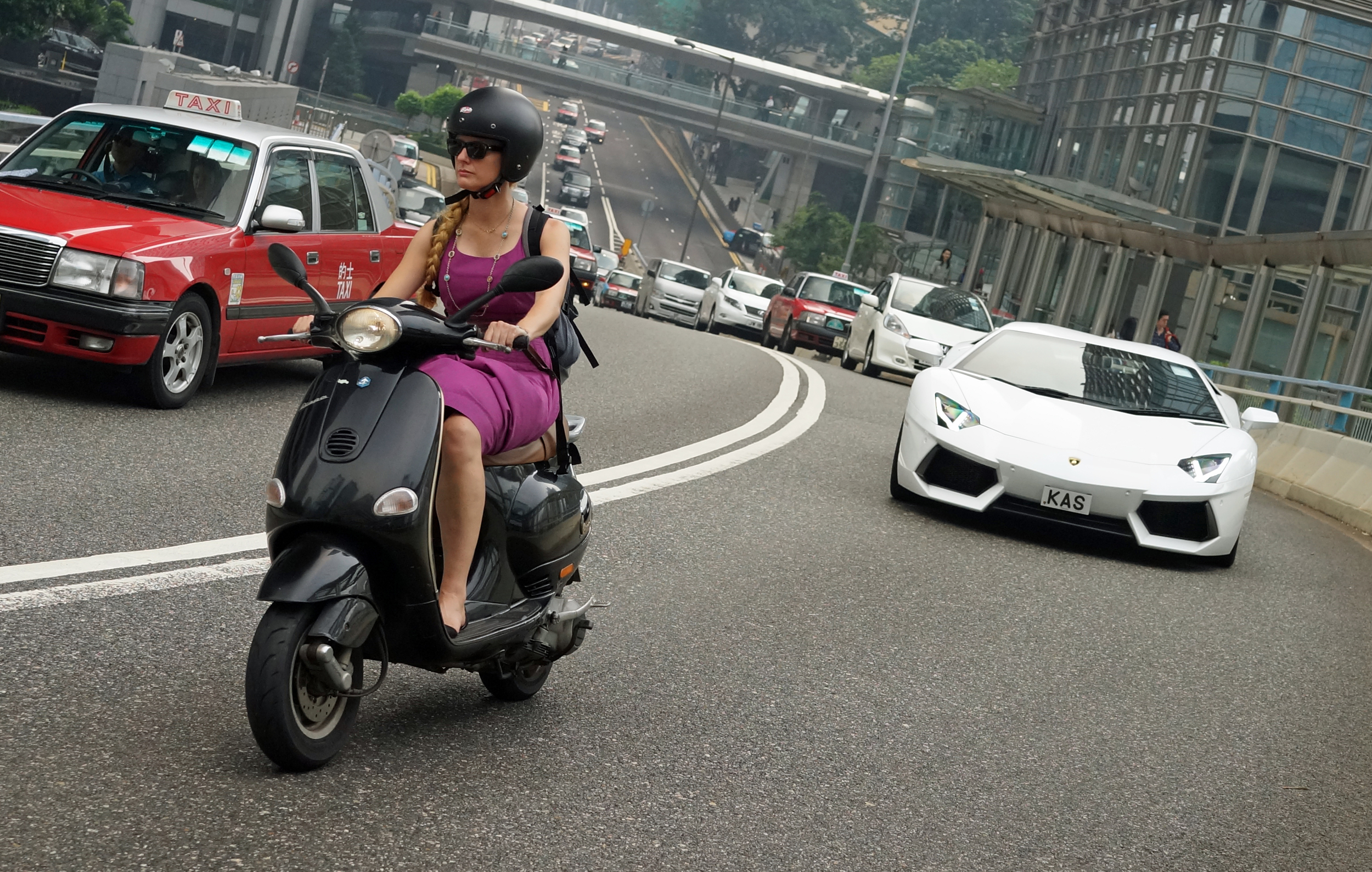 I had no idea I had even got the white Lamborghini rushing up in the background, my focus was on the white lady on her Vespa scooter which in itself is a rather unusual sight.
