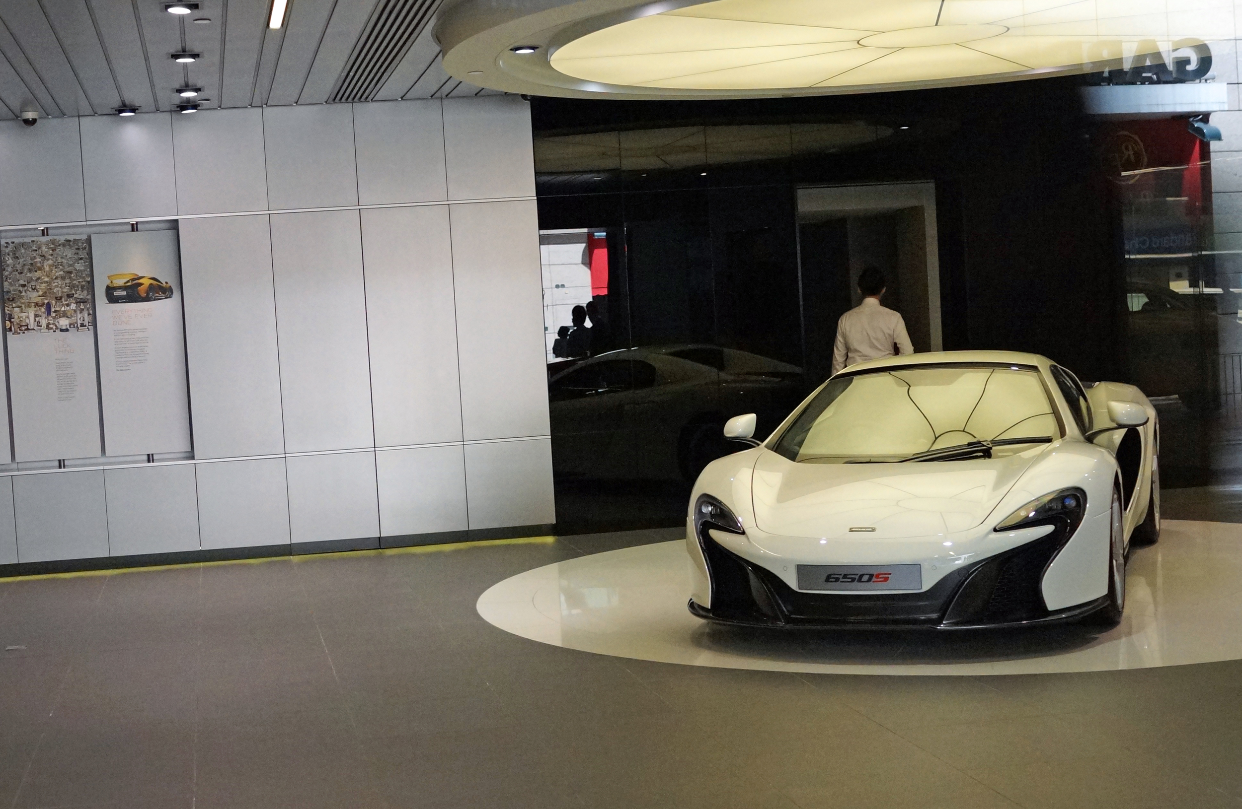 The owner of McLaren XX 155 has a lovely attitude which is is in stark contrast to the muppet's who work at the McLaren showroom in Wanchai, who always refuse me entry to take a photo of the new McLaren supercar pictured above. I understand it is a very expensive car but I do not dress like a street sleeper and I have a fancy camera, what possible harm could it do to let me, a huge fan of the McLaren take a couple of photographs up close and personal. I have now been refused entry 5 times including today... I will get the shot as soon as a couple are sold and are then prowling the streets of Hong Kong... even the Manager at the Pagani showroom in Kowloon Bay let me in eventually to take some pictures of the Zonda. Muppet's.