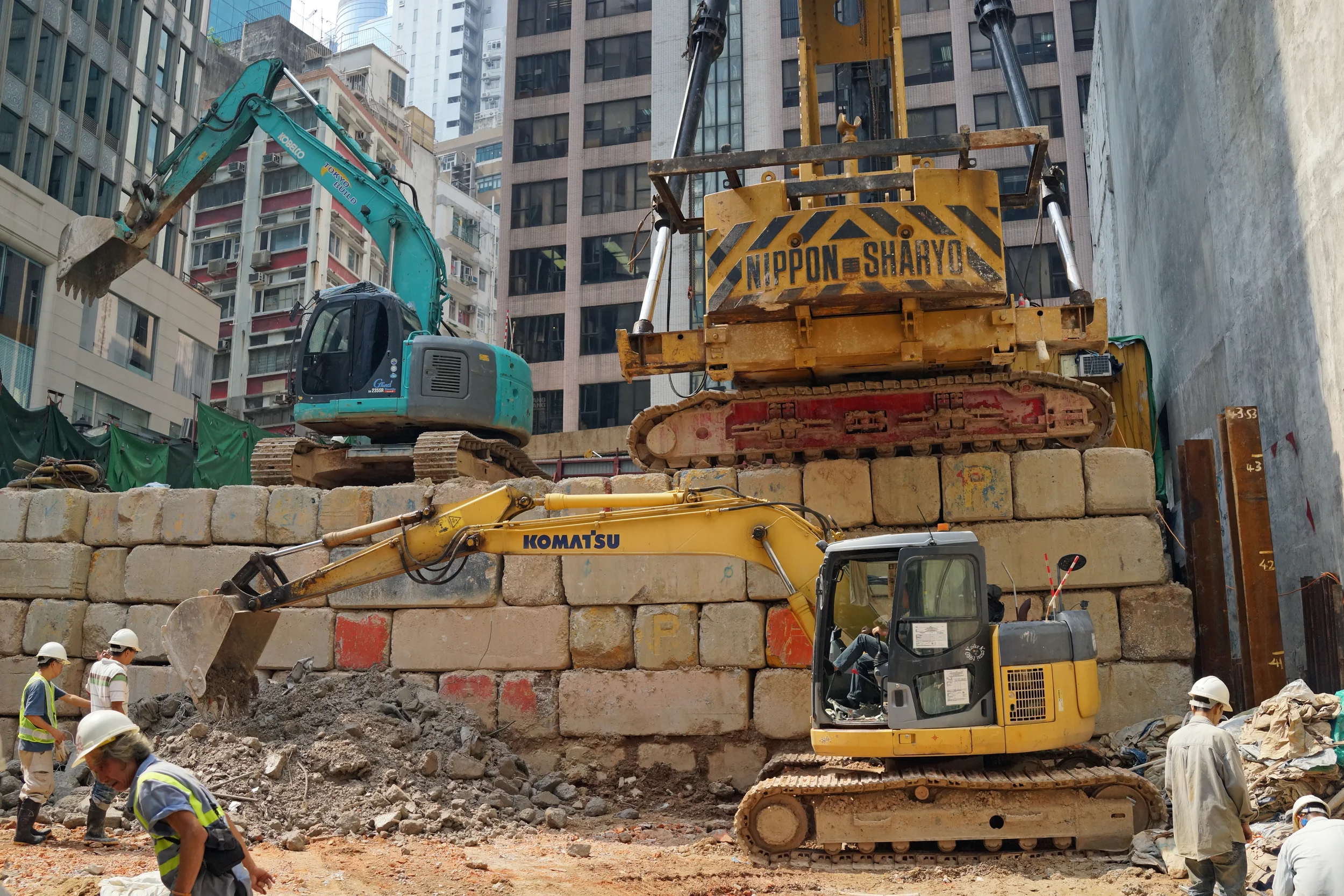 A monster pile driver on some monster bricks at a building site in Central District