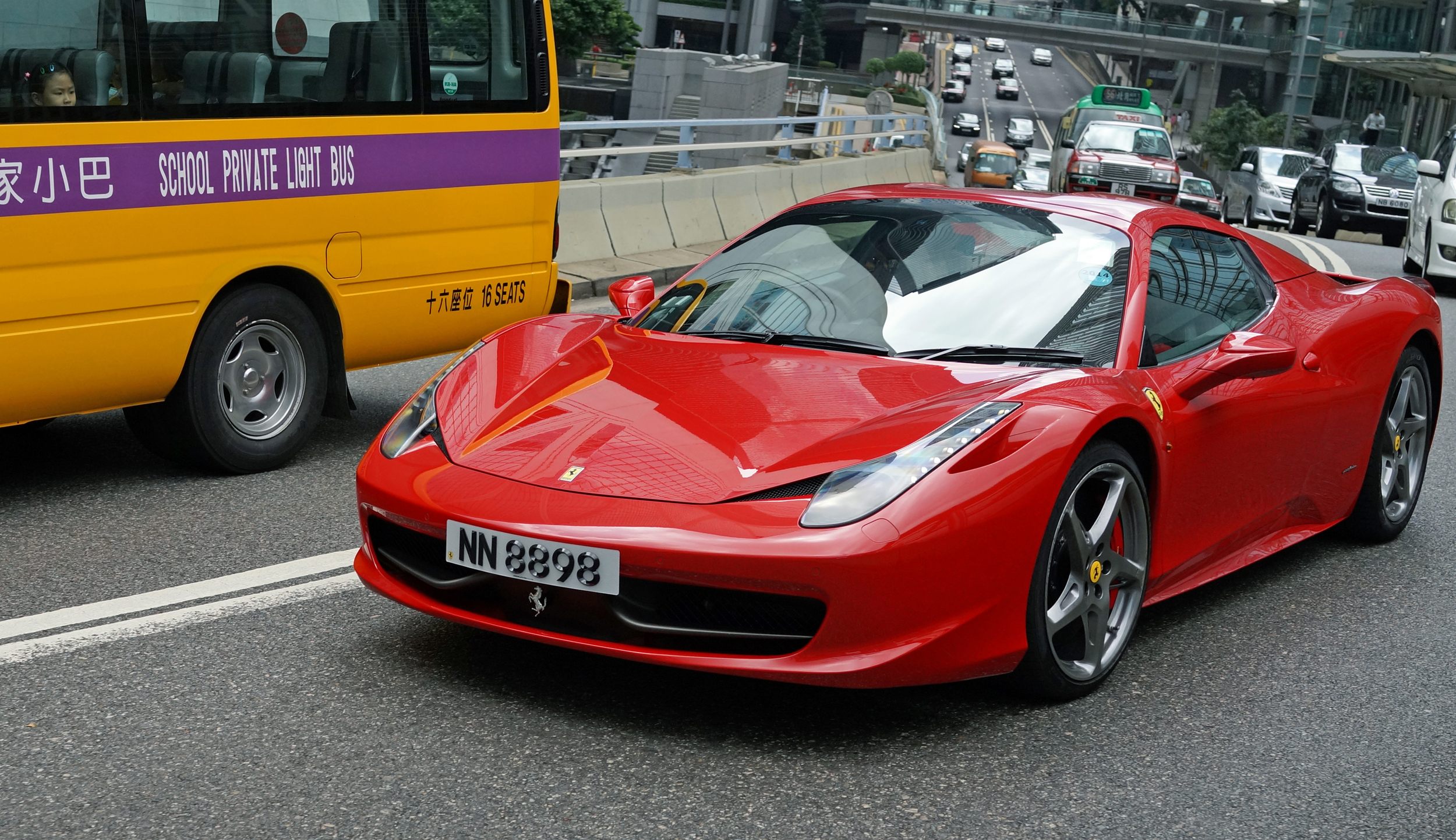 Look very carefully at the little girl on the school buy staring wistfully at this rather gorgeous Ferrari - love at first sight!
