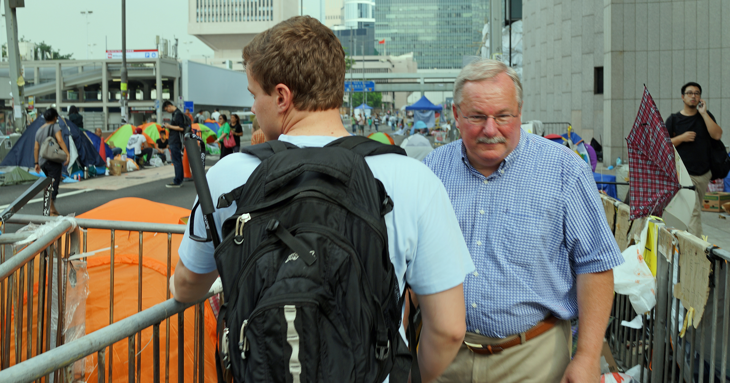 Brandon and Travis ponder the rather quiet Occupy Central site in Central - like me they were thinking 100 clowns would work as well.