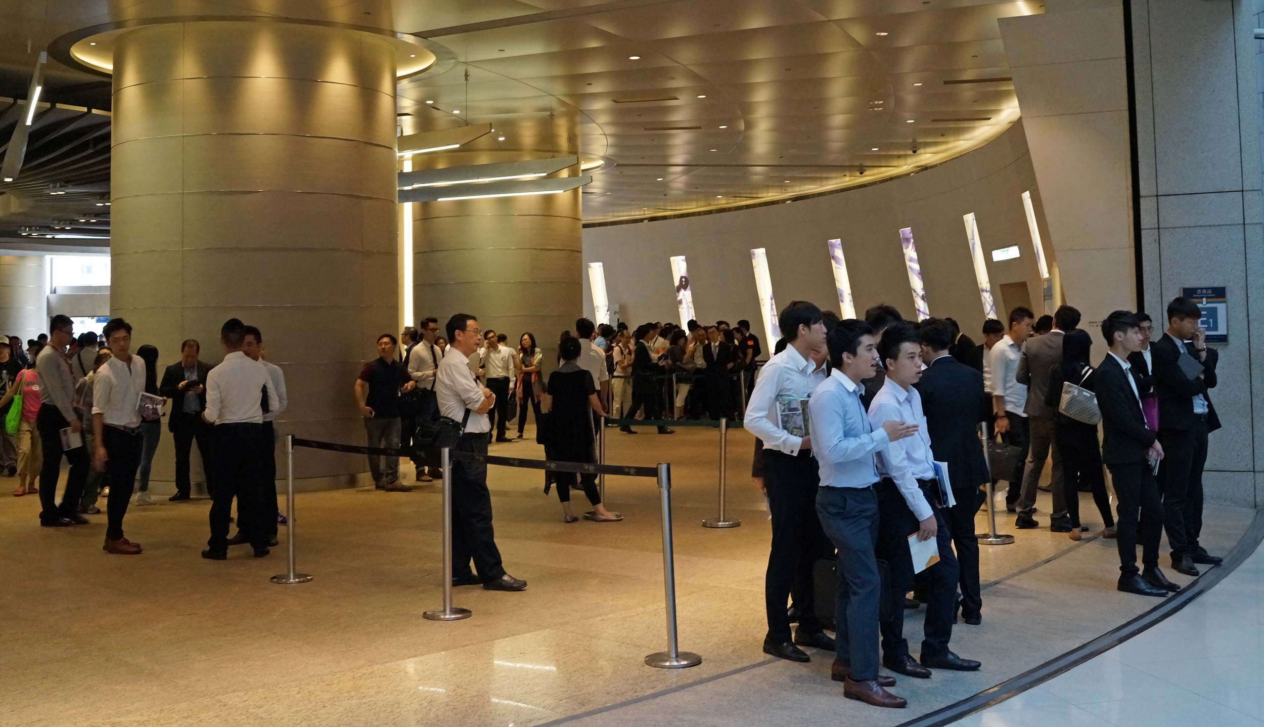 Like a swarm of locusts, young property agents wait for potential clients to come out of IFC Mall (one of our finest malls) - I wouldn't trust these people as far as I could spit and many of them have not learnt to shave yet.