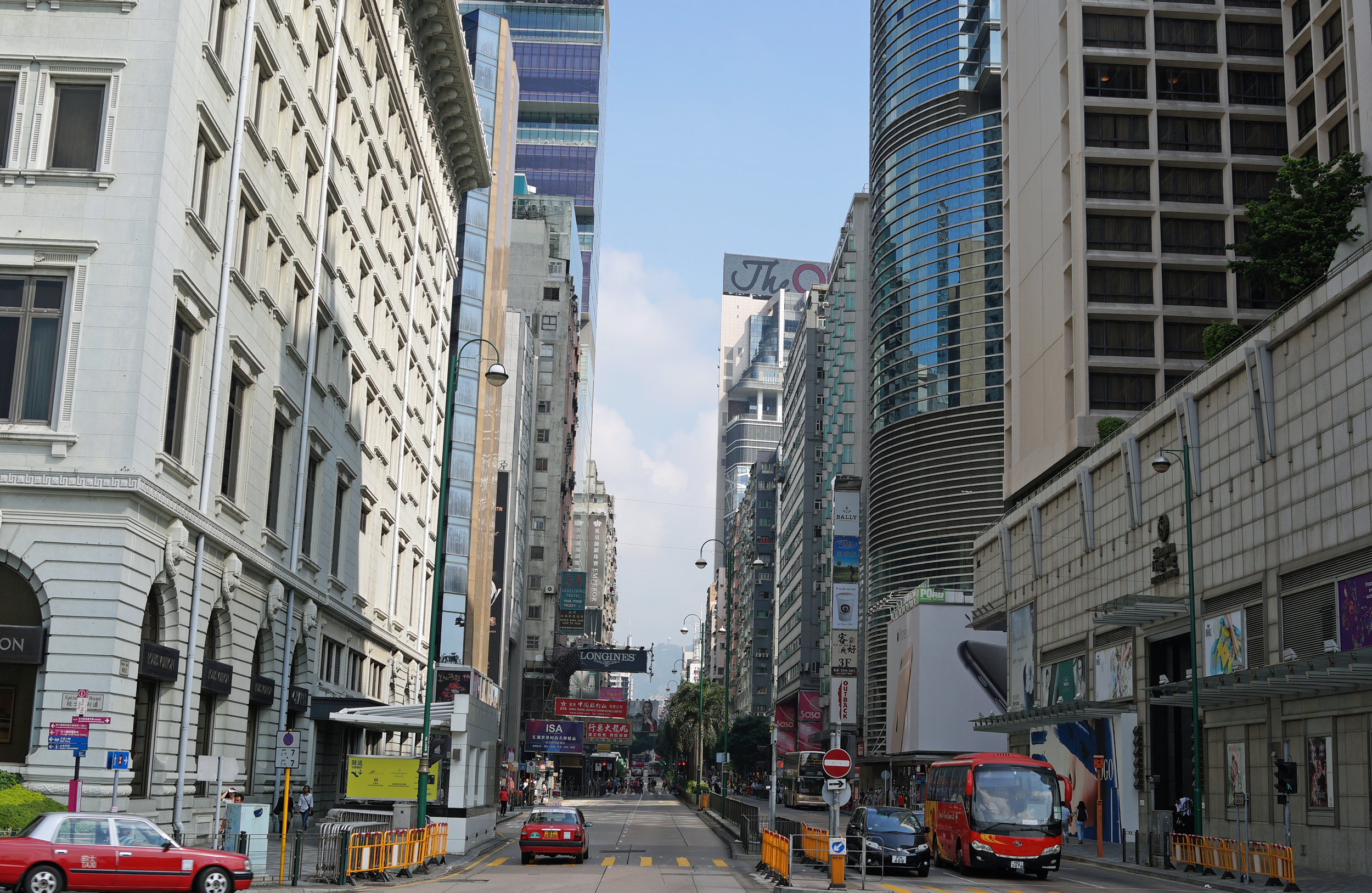 The Peninsula Hotel on the left, the Sheraton Hotel on the right - this is the start of Nathan Road in TST, Kowloon. 2 miles of non stop shopping