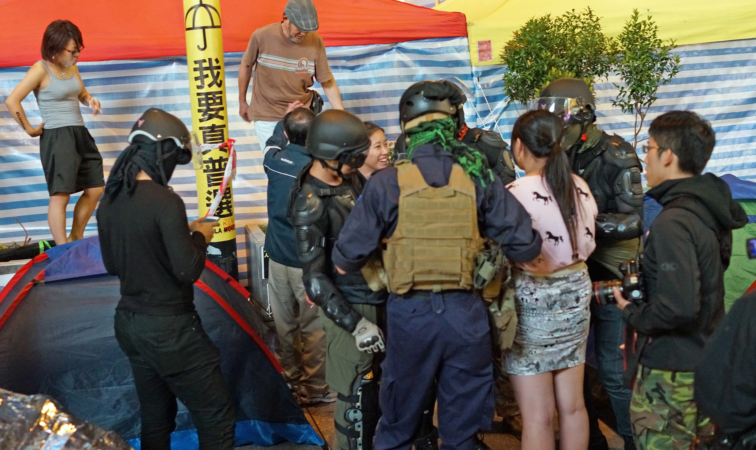 Hamming it up for the 1000+ news reporters waiting for blood to be spilt... and they will claim Police brutality when they get pepper sprayed. It is time they grew up and stopped thinking that this is a real life video game.
