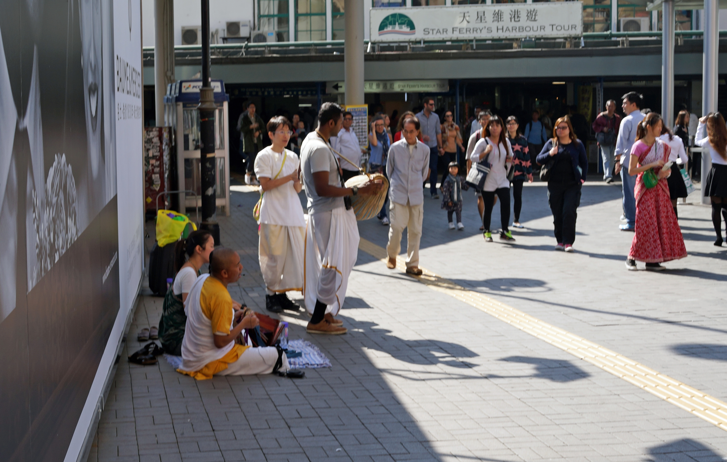 We get all the odd balls here - this is a bunch of Hari Krishna's trying to convert Mainland Chinese tourists with little success.