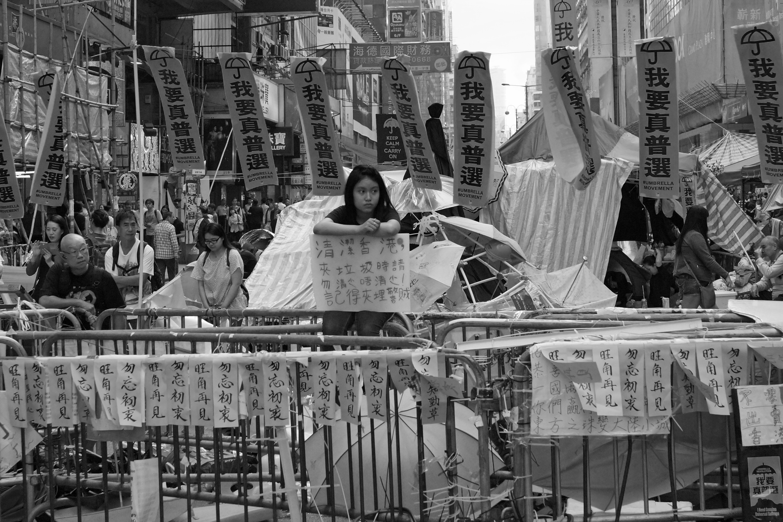 The young lady belongs in a library - image taken 25th November as the battle to clear the streets in Mong Kok starts.. the so called peaceful protesters are reacting violently (as they have done since day one) and it is time our Government dealt with this stupid protest decisively.
