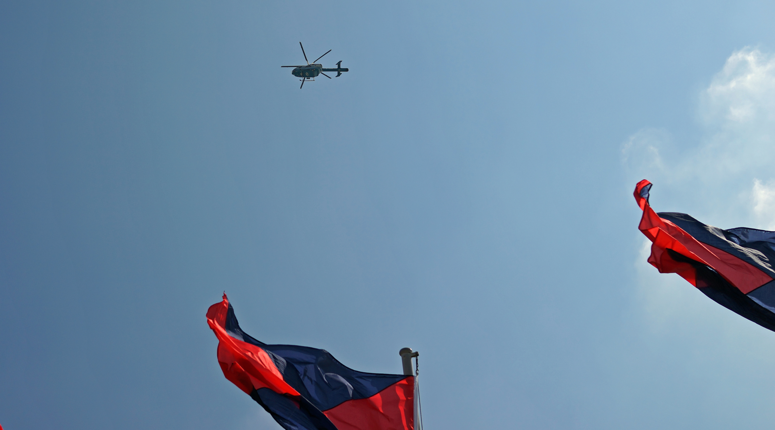 An "action" shot of the Peninsula Hotel helicopter taken from the roof of the Ocean Terminal - I wouldn't mind doing the helicopter tour it is just a tad expensive
