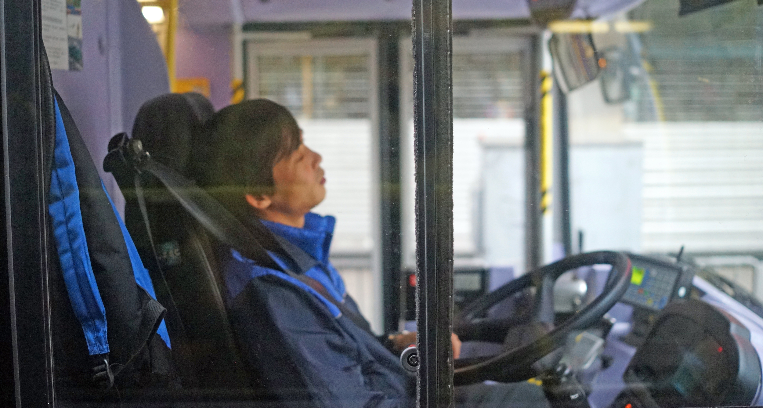 We were stuck at traffic lights for a while and I took this image of a sleeping driver from the bus I was on....