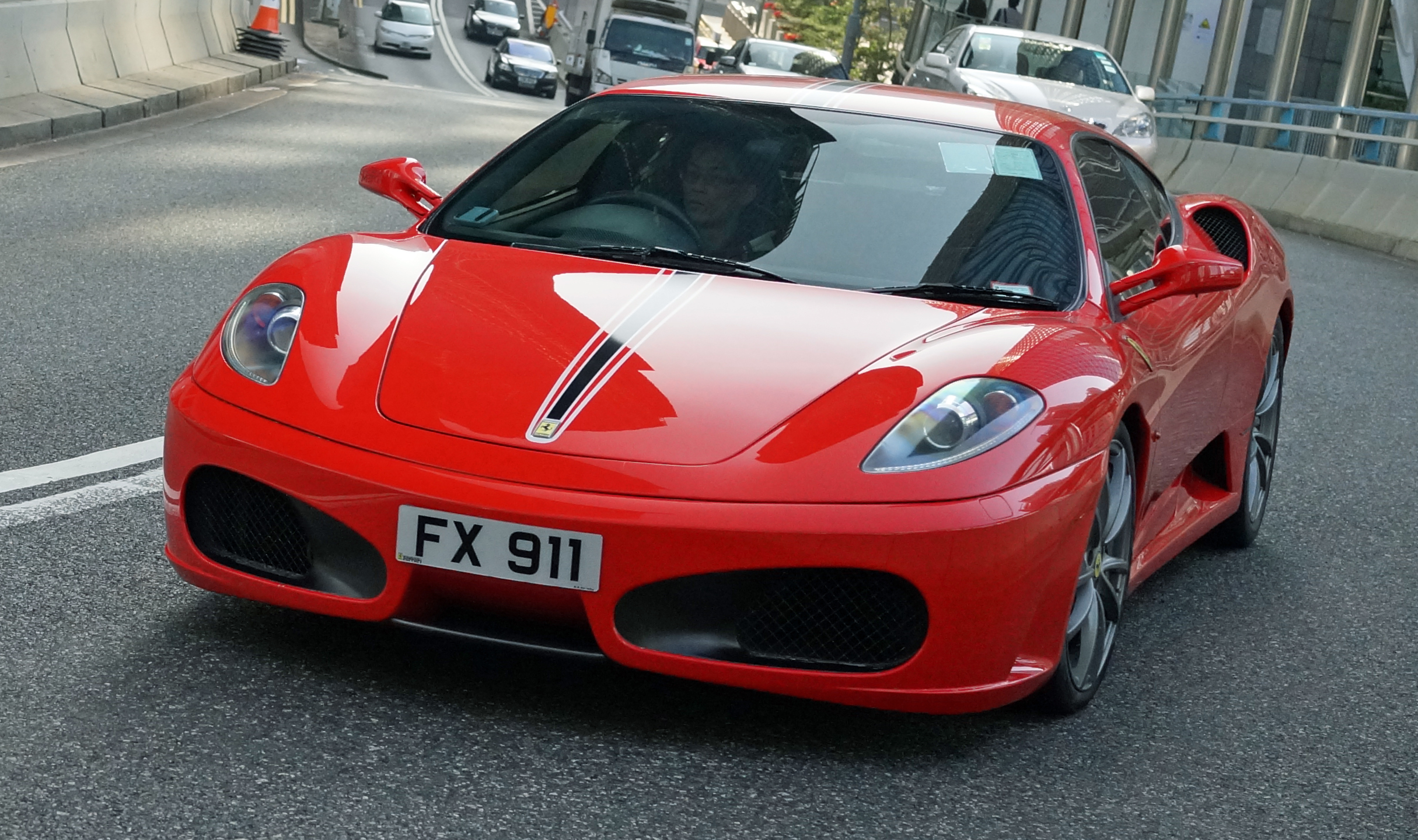Ferrari, a somewhat legendary car and I love them but in Hong Kong they just seem to be too common and there is something inherently wrong with a 4 year old child strapped in the front seat!! (a common sight here)