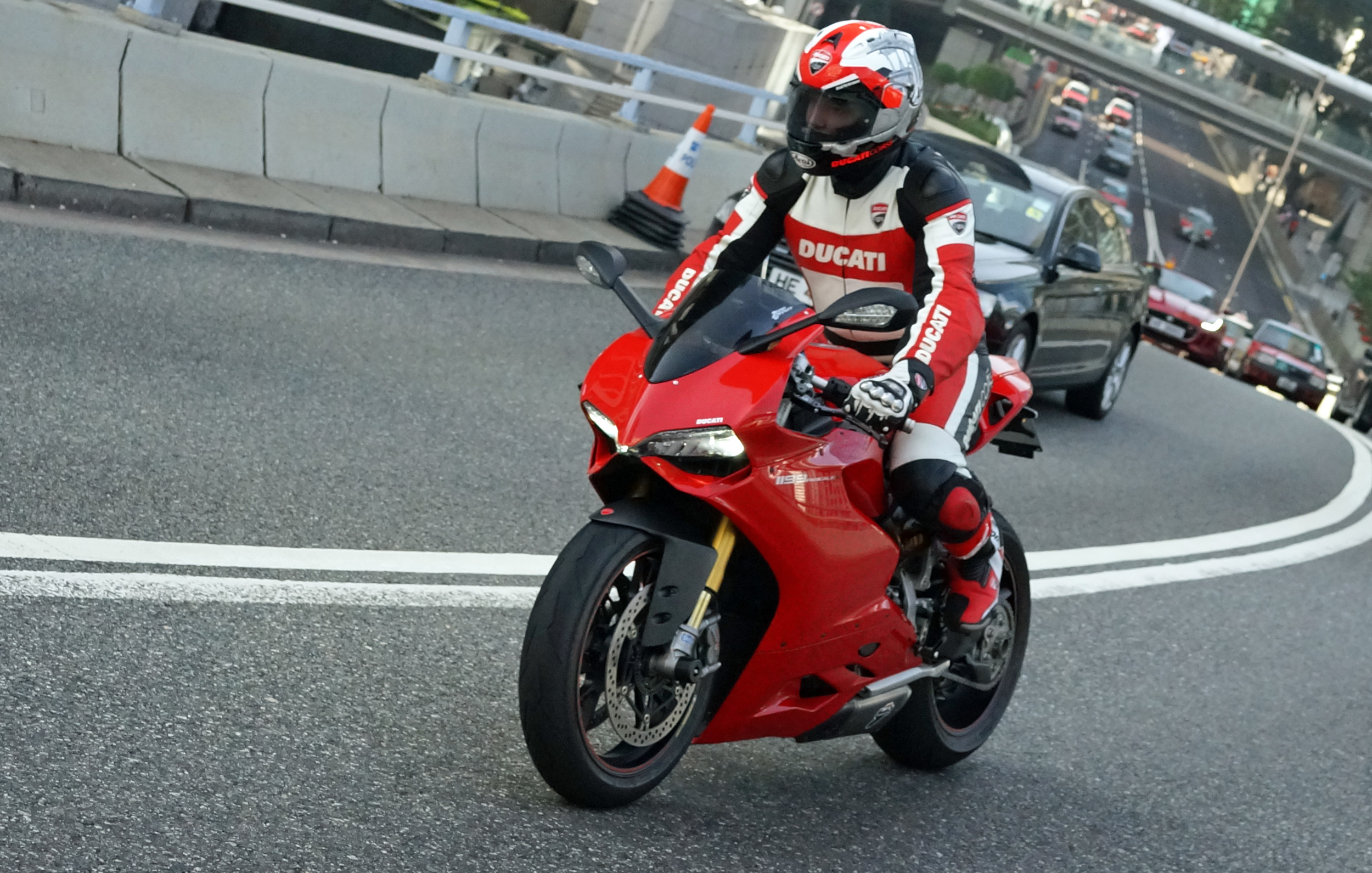 I am well aware this is NOT a car but I am a bit of a motorbike fan and this is the first time I have actually seen a guy wearing leathers.. normally it is shorts, a t - shirt and flip flops!.