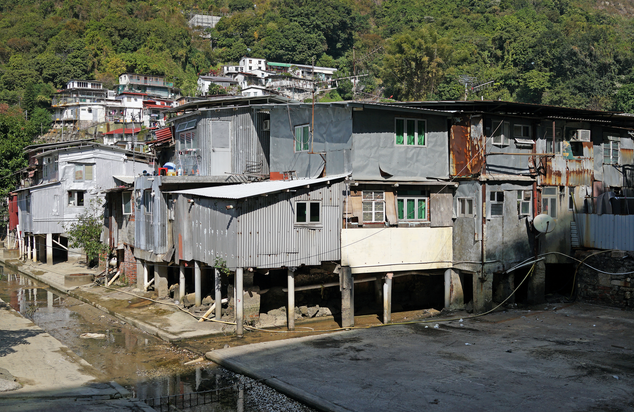 Sham Tseng in the NT is home to one the last remaining semi legal squatter villages in Hong Kong, it really is something to behold as it is surrounded by quite new gigantic gleaming apartment blocks....