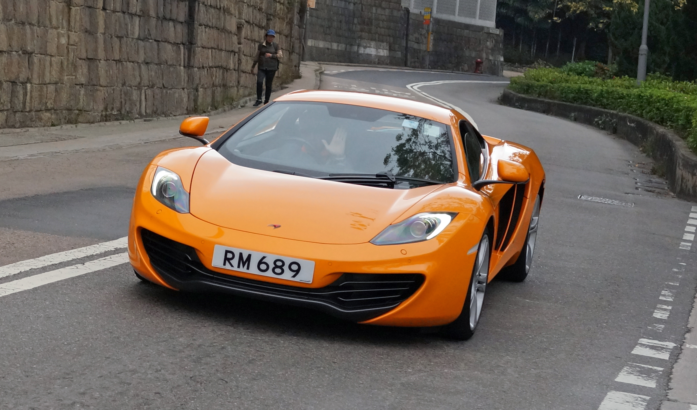 This is a McLaren, one of the most desirable sports cars in the world and a personal favourite of mine and I get a real thrill photographing them as they whizz by at 120mph.. I just think it is fabulous that the rich folk here indulge a little in buying these wonderful works of art and get immense enjoyment out of them.