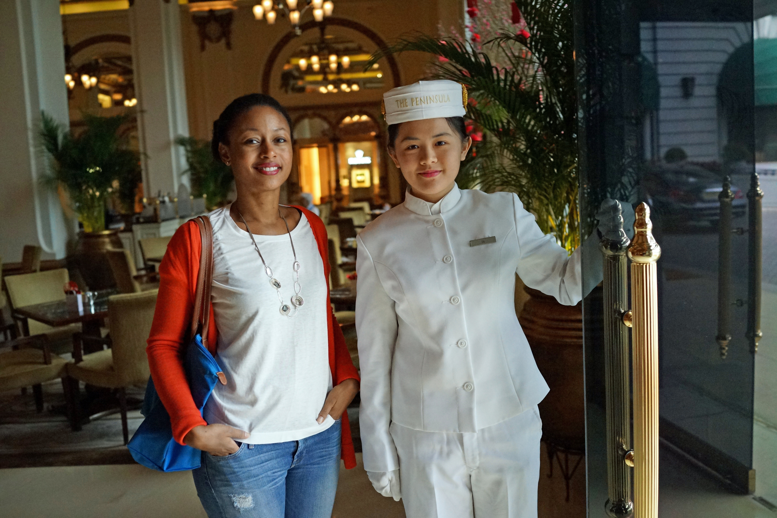 Meet Leanne, Leanne had just a few short hours in Hong Kong and here she is with the Bell Girl (!) at the famous Peninsula Hotel