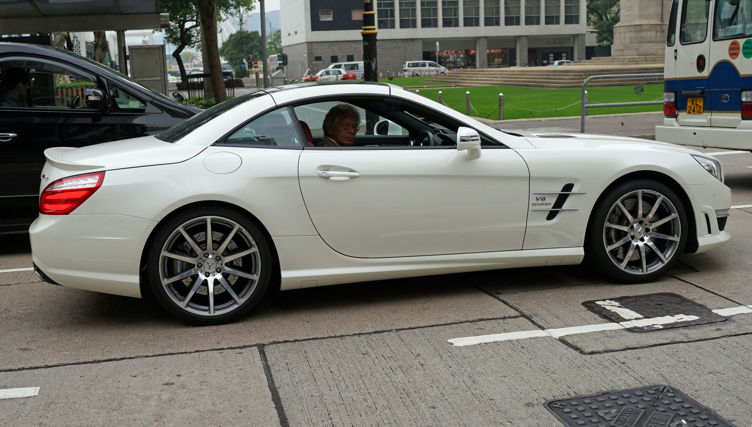 The classic death stare! I love taking pictures of fancy cars, people should not have to apologise for dropping large amounts of money on cars such as this sporty Mercedes, I imagine this chap has a lot of fun driving this beast, the least he could have done was given me a smile and a wave...