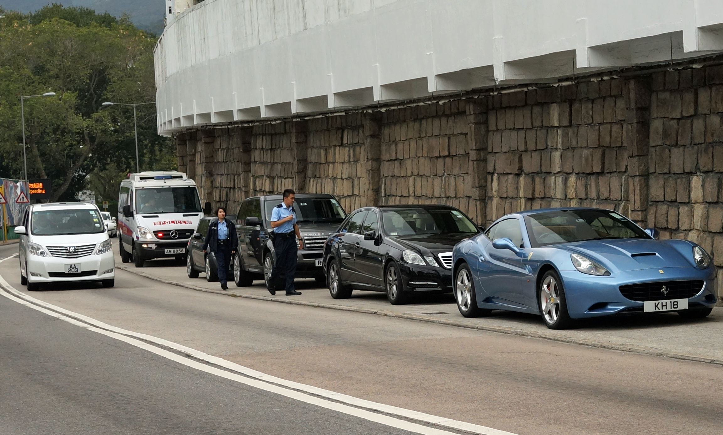 Absolute proof that the Police do give parking tickets to rich folk - these cars are parked on the sidewalk over the road from the Hong Kong Country Club so they deserve the ticket!