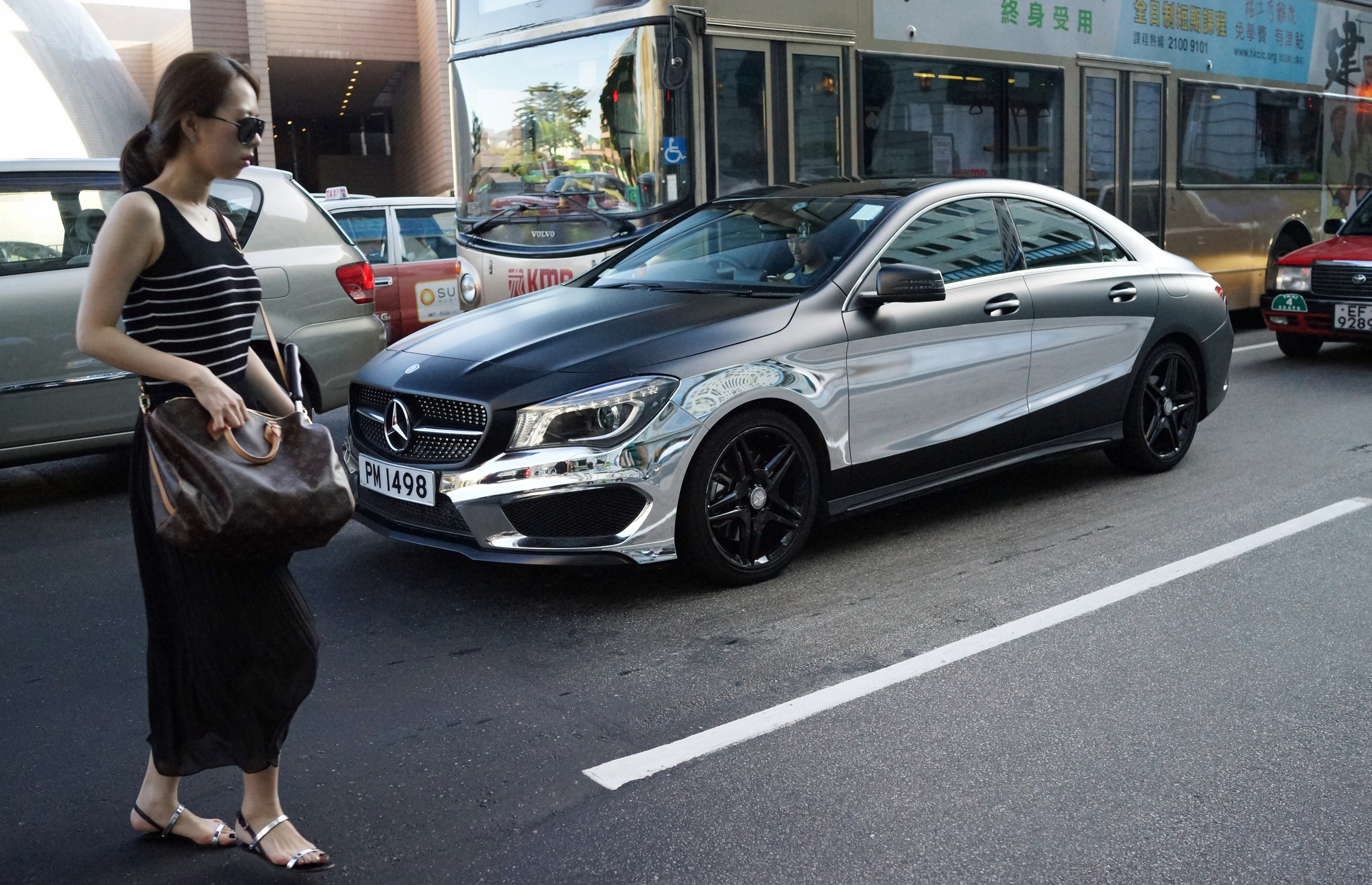 My focus was on the awesome half metallic Mercedes Benz in the background, it was only later I noticed the lady and her LV bag - a perfect fit for the guy driving the Benz! -