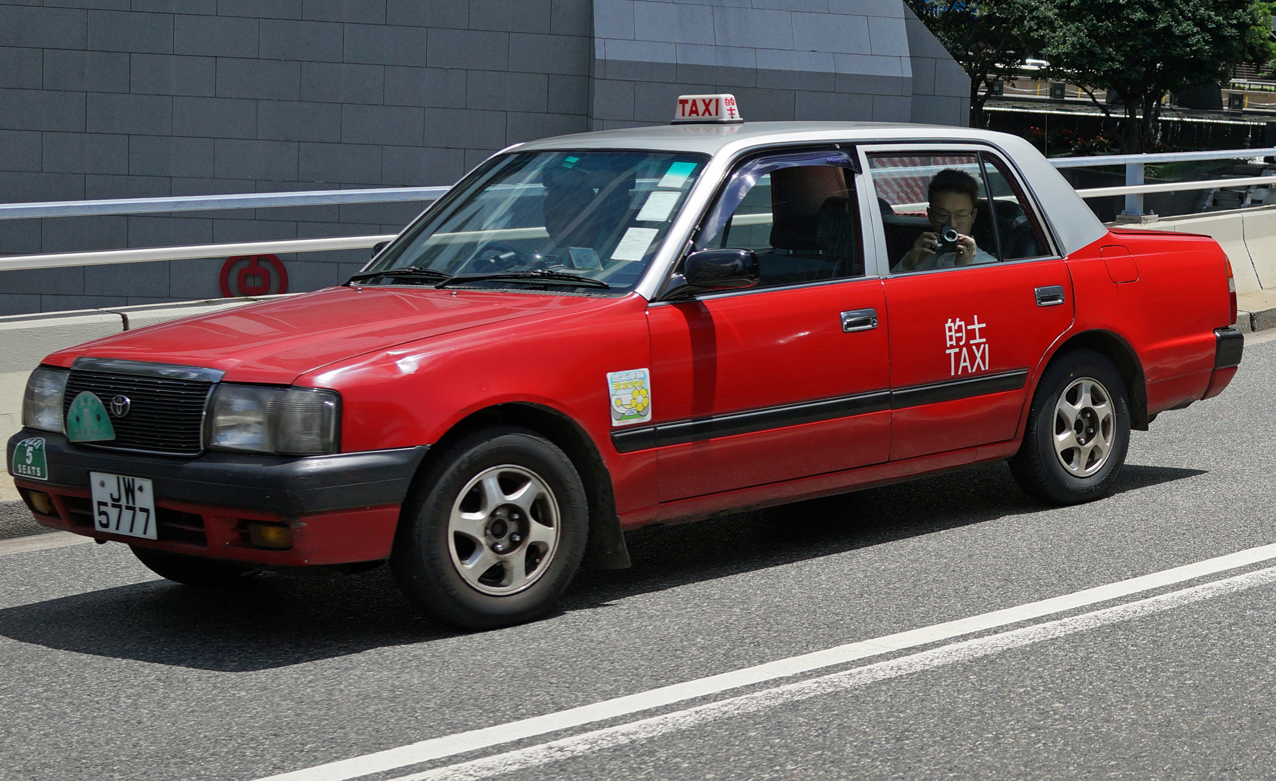 I was photgraphing cars and this taxi zipped by and I got this image of me taking a picture of the guy taking a picture of me! -