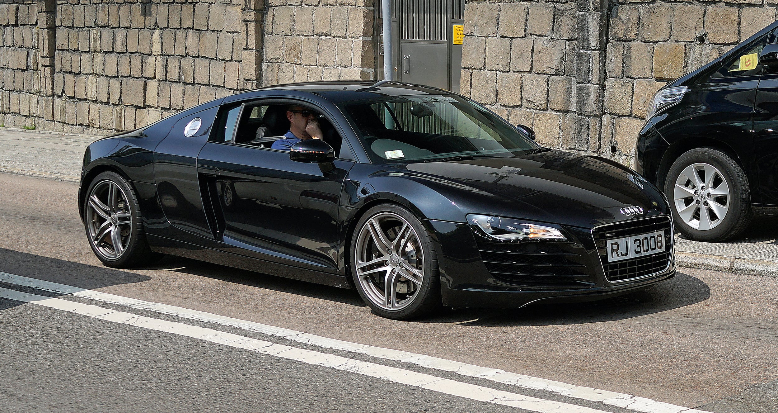 ... and when he can't be bothered with the Harley he takes out his Audi R8 for a spin !!