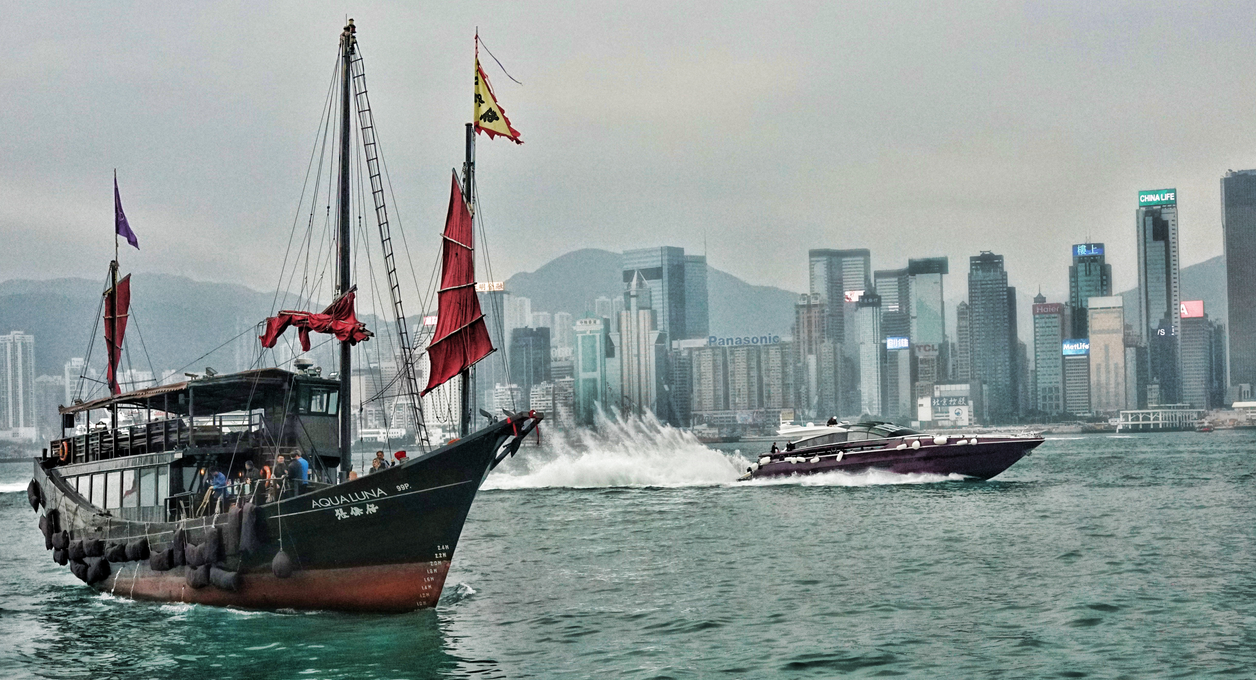 The rather lovely Aqua Luna that potters around Hong Kong harbour day and night being blown off by a rather nice speedboat....