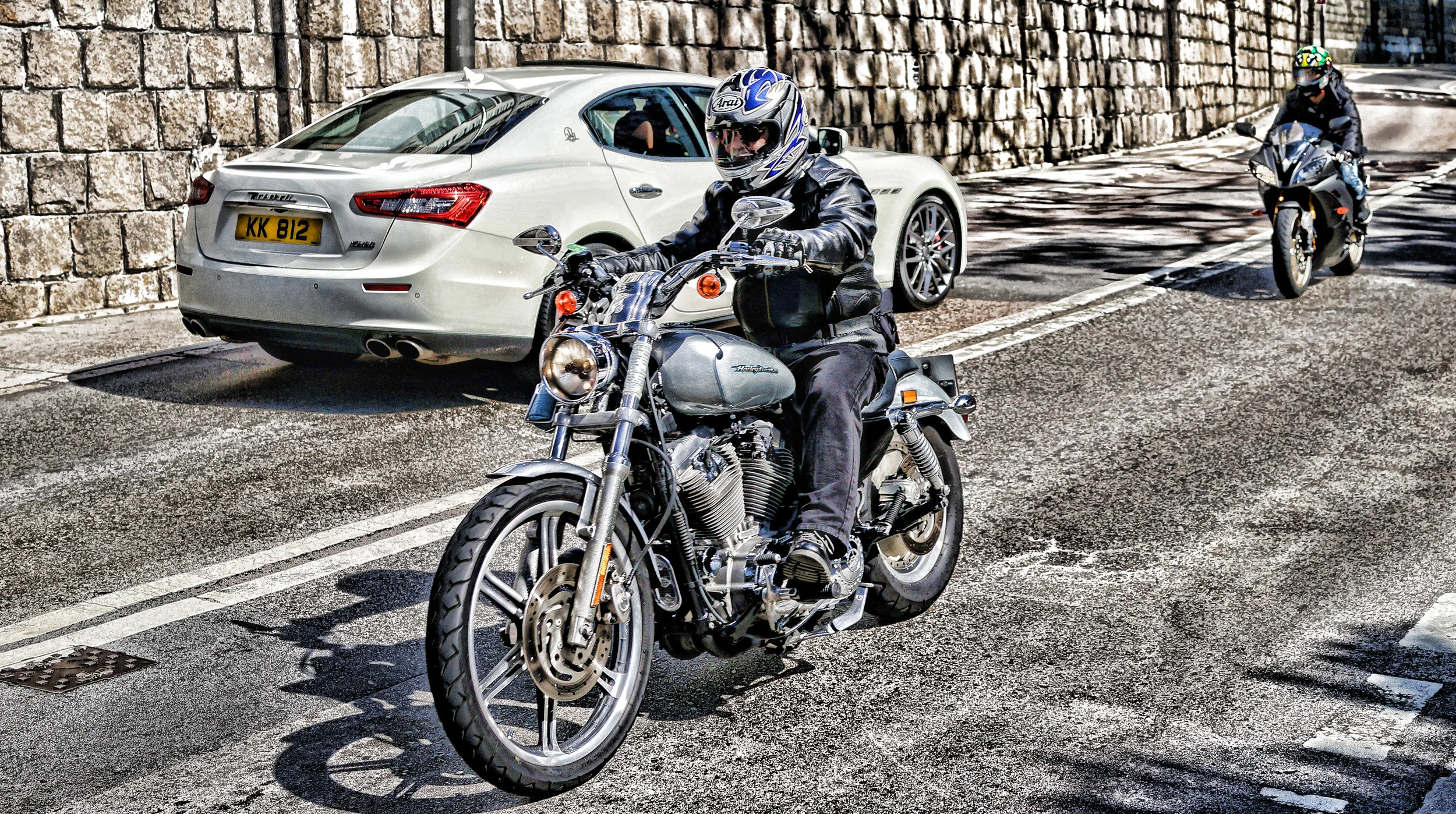 Quite a rare image, a fancy bike and a fancy car in the same image, I think a Maserati has a lot of class and that engine sound! and a Harley speaks for itself... that rumble you can hear a mile away!! ... awesome!