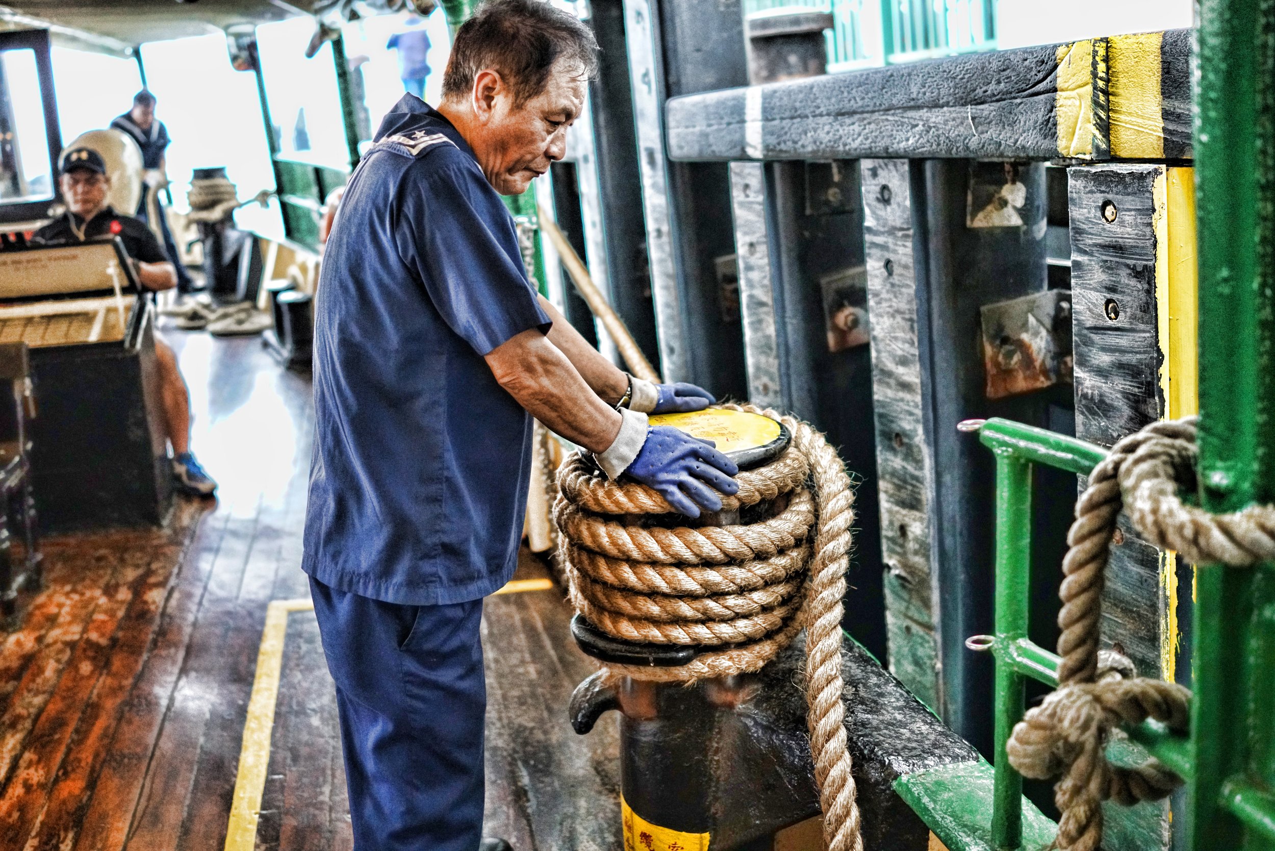 This Star Ferry employee looks a bit jaded doesn't he? and who can blame him, he probably wants to hang up his sailor suit and enjoy retirement. The Star Ferry is facing recruitment issues because the young folk of Hong Kong are simply not interested in manual labour particularly if the work is outdoors... such a shame... in the past couple of years I have seen ONE young chap working on a Star Ferry, the work is hardly back breaking but it probably is a little tedious, the Company pays a fair wage so it is a bit perplexing that no one wants to work on a ferry.