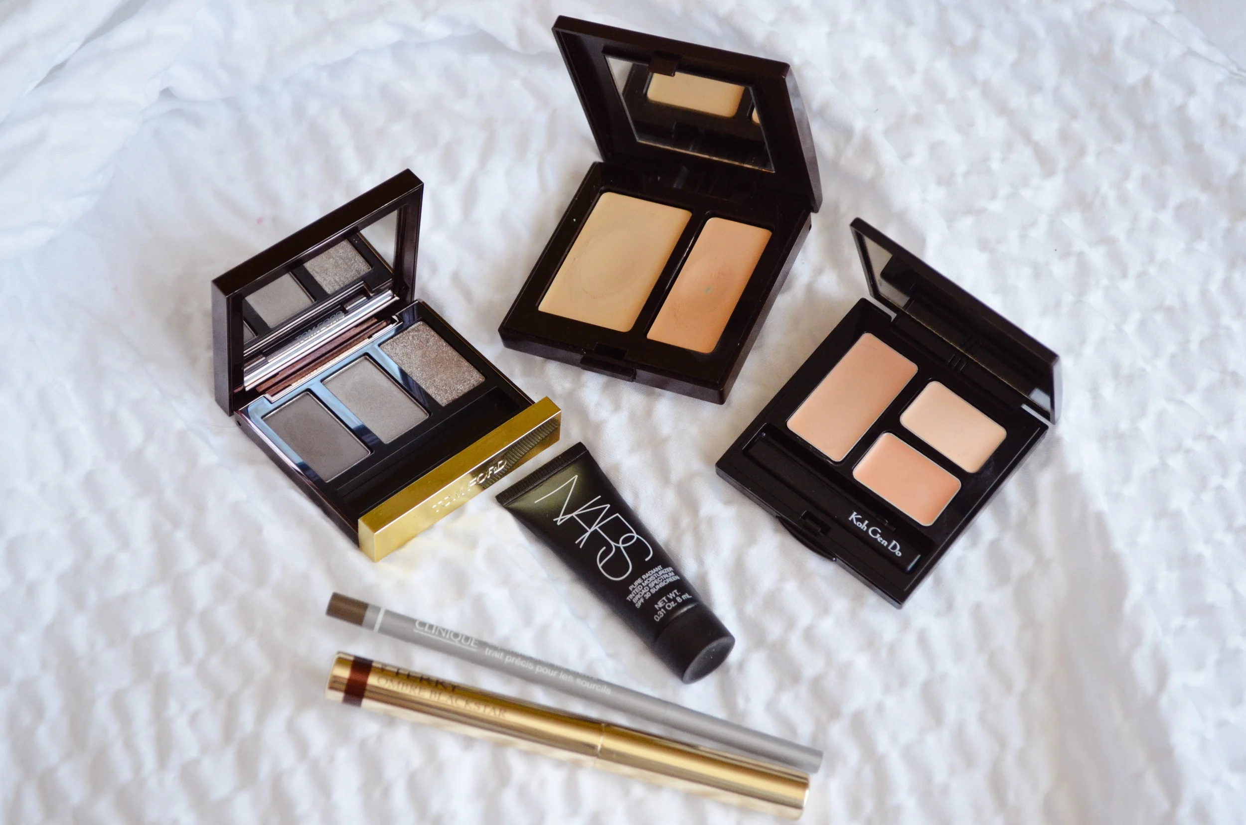 Tom Ford She Wolf, Laura Mercier Secret Camouflage, Koh Gen Do Moisture Concealer, Nars Pure Radiant Tinted Moisturizer, Clinique Super Fine Liner for Brows, By Terry Ombre Blackstar in Bronze Moon