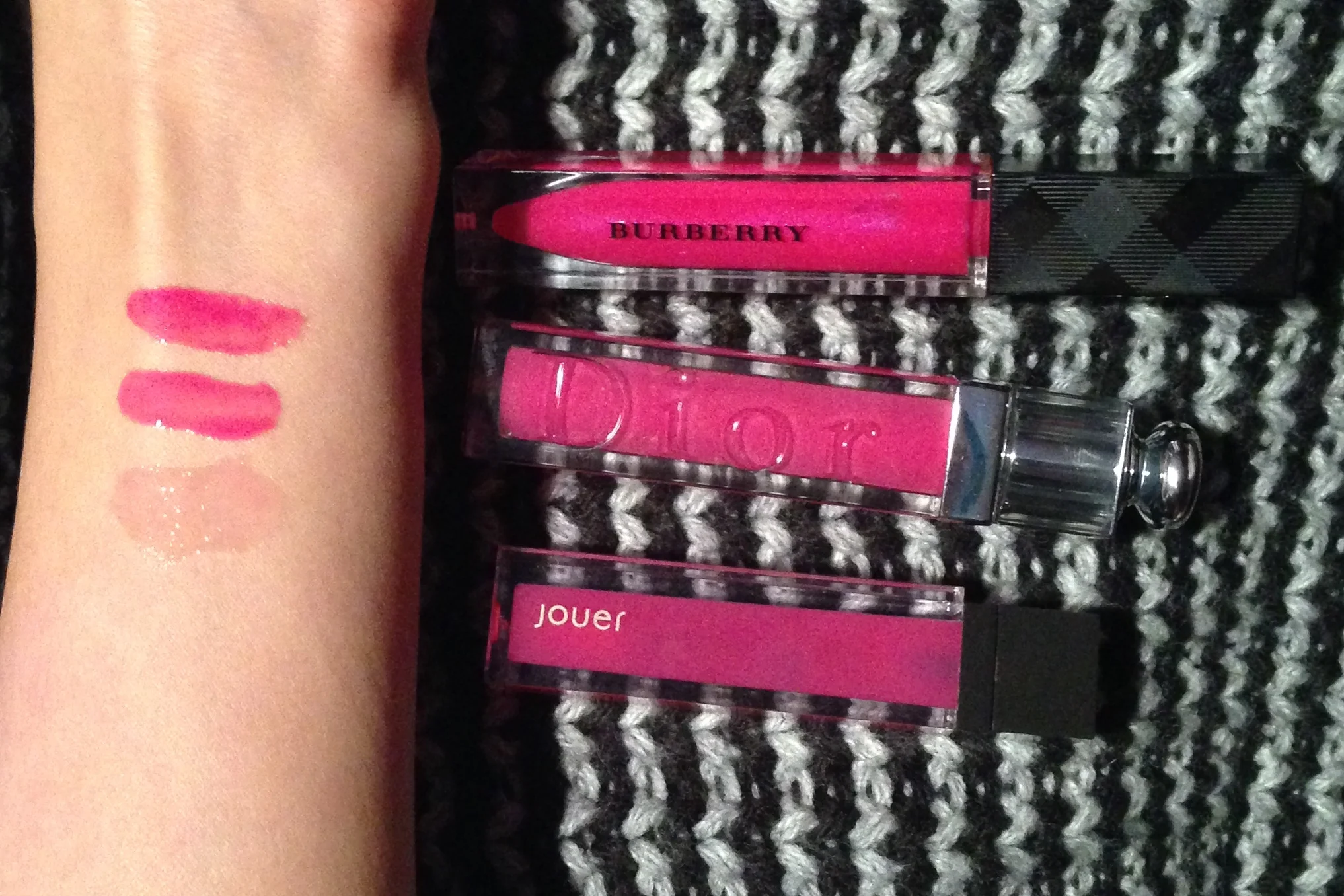 Swatches Top to Bottom: Burberry Lip Glow in Pink Sweet Pea, Dior Addict Lip Gloss in Exquise, Jouer Moisturizing Lip Gloss in Malibu