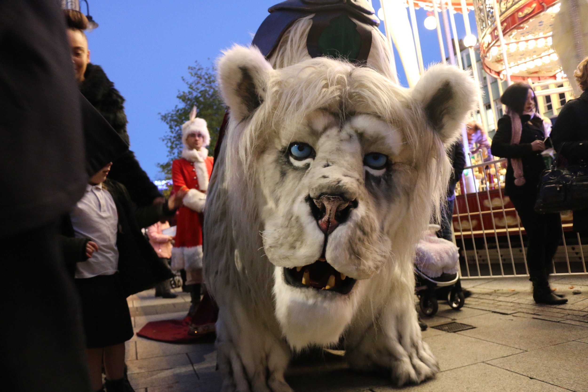 Christmas Snow Lion Winter Lion White Lion Animatronic  Costume Character Creature Puppetry Street Theatre Performance Walkabout Mix n' Mingle Event Entertainment Outdoor Arts