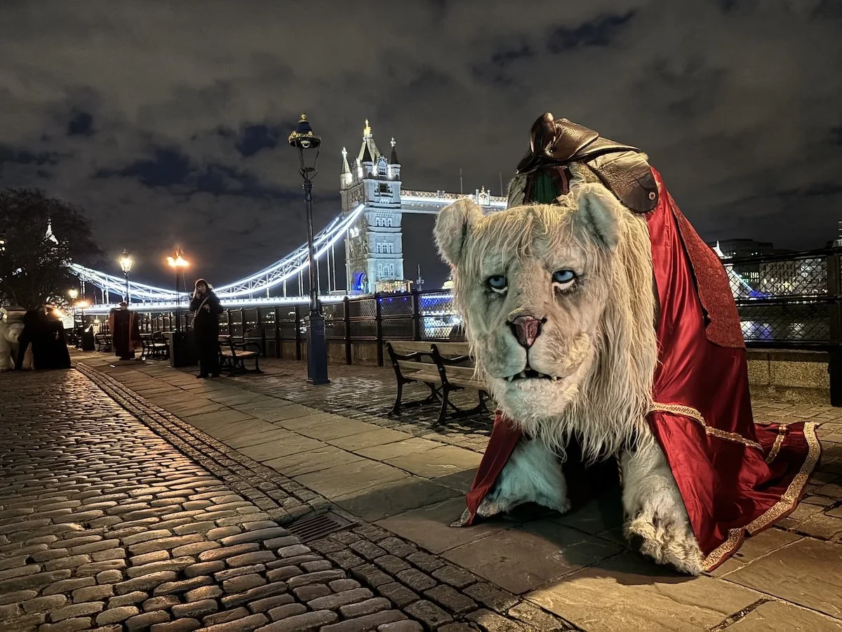 reature Encounter's Snow Lion puppet performing at a private event at Tower Bridge, London — large-scale character puppetry for exclusive celebrations and corporate entertainment.