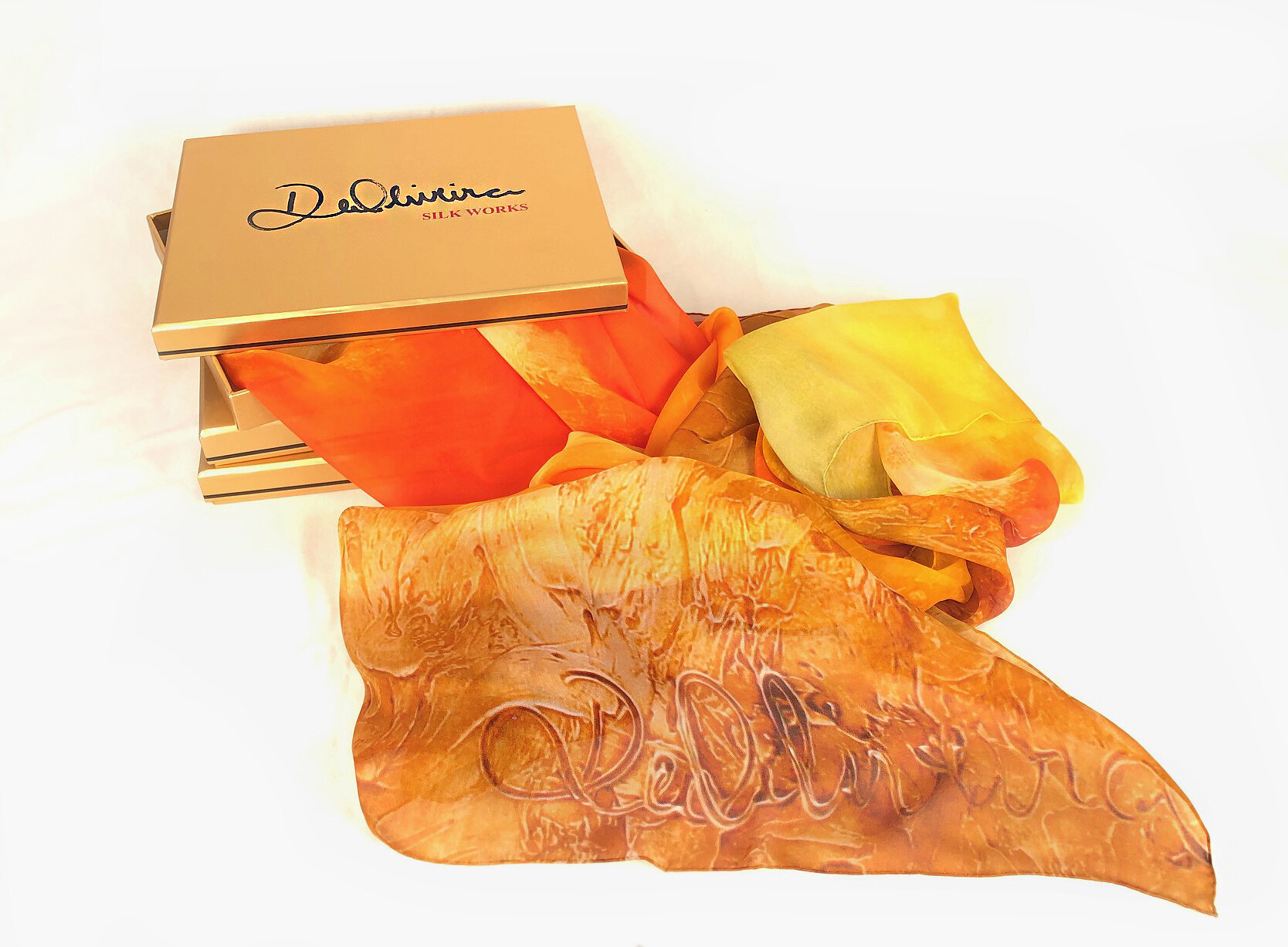   Printed Silk Scarf   This line consists of large, 100% silk scarves with luxurious hand-rolled hems featuring images of my work as taken in my studio. Highlighting bold, provocative, lavish earth tones. The silk is quite lustrous and luminous which