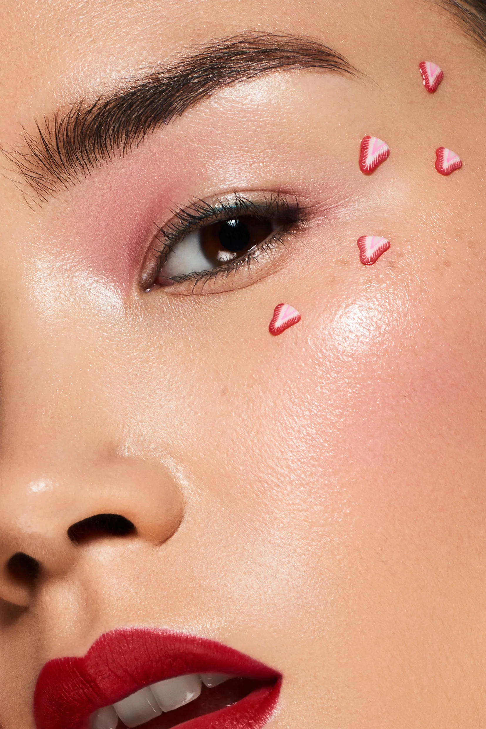 Close up macro shot of Asian beauty model with strawberry eye sticker makeup