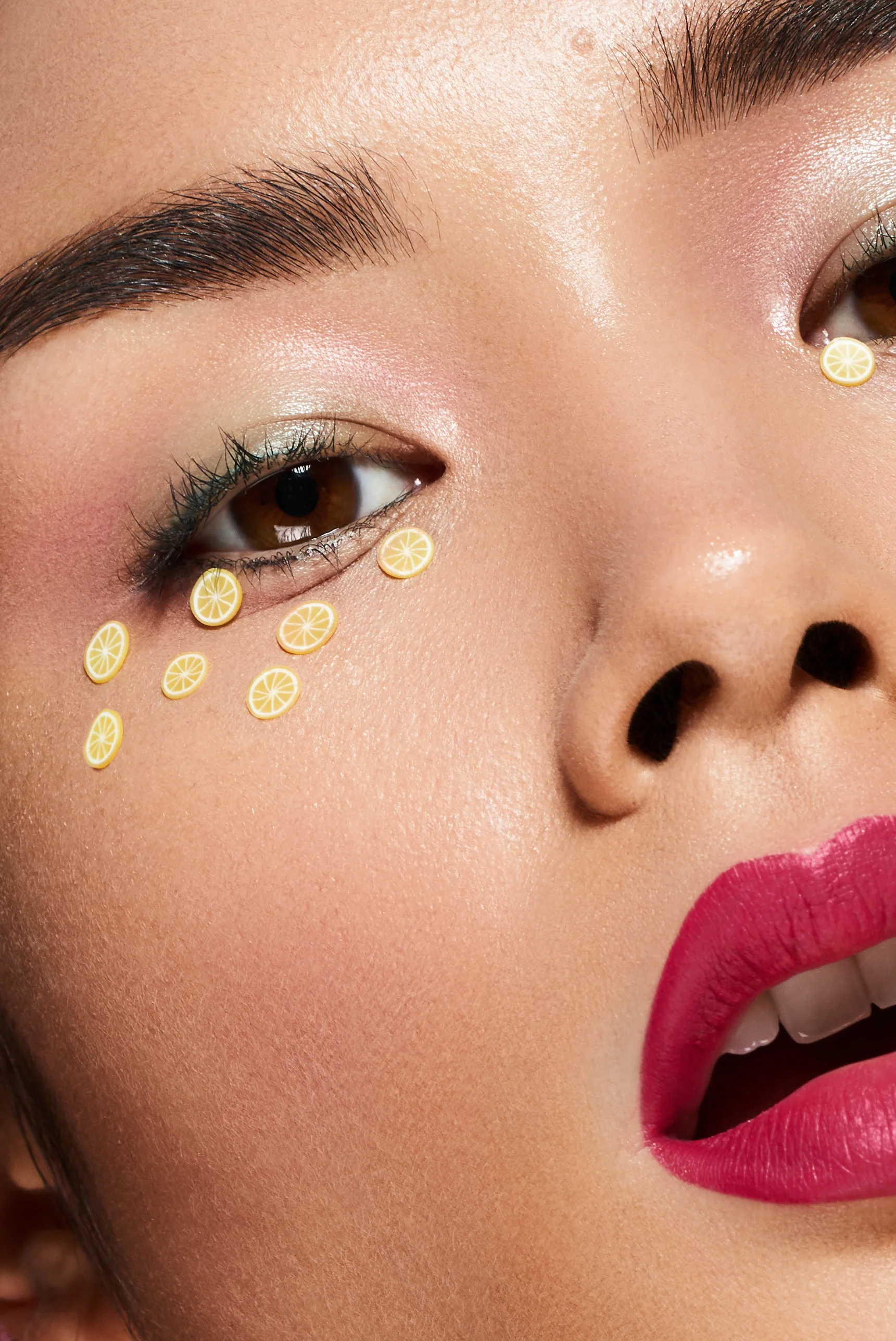 Close up macro shot of Asian beauty model with lemon eye sticker makeup