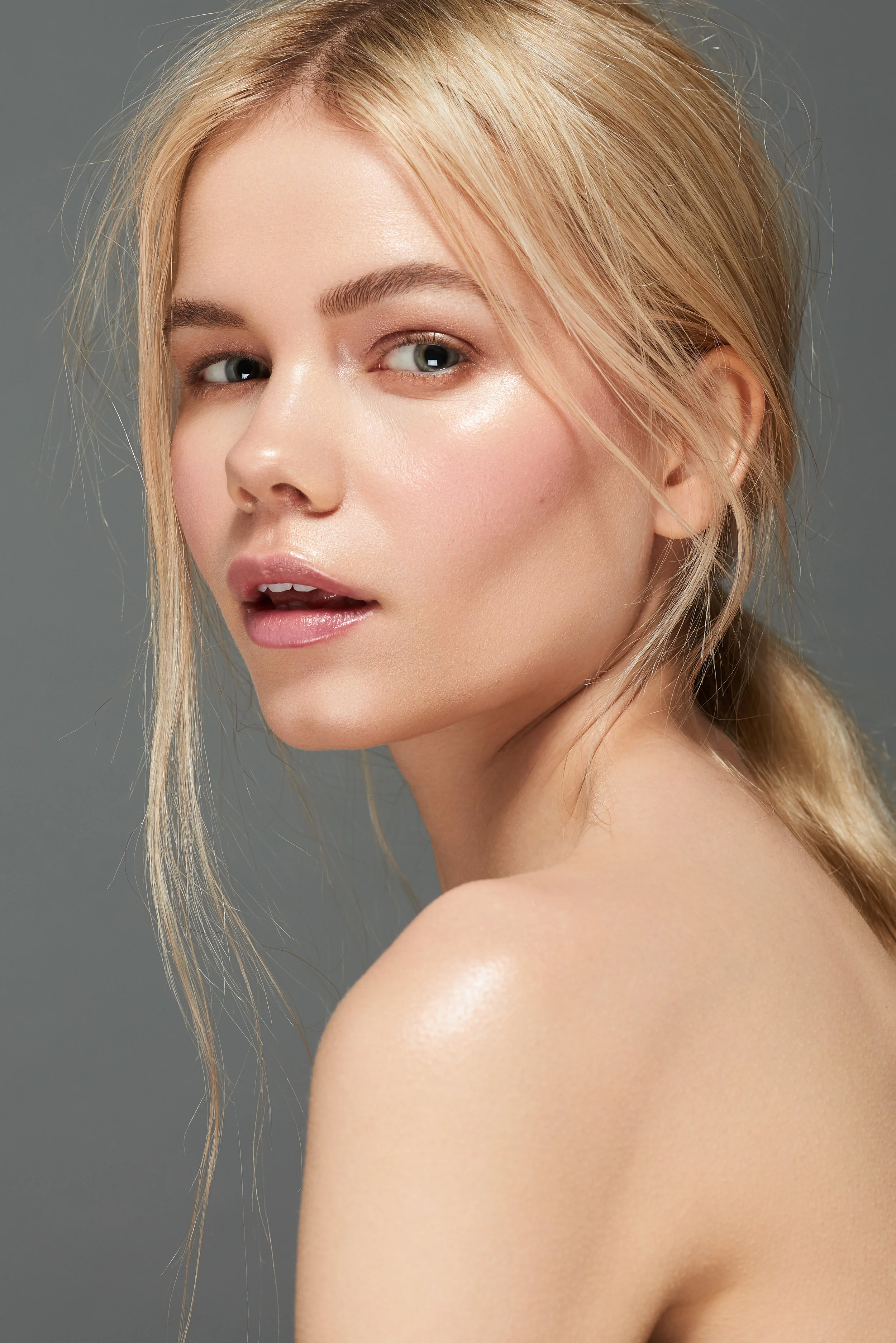 blonde female model with natural makeup posing for beauty skincare shoot