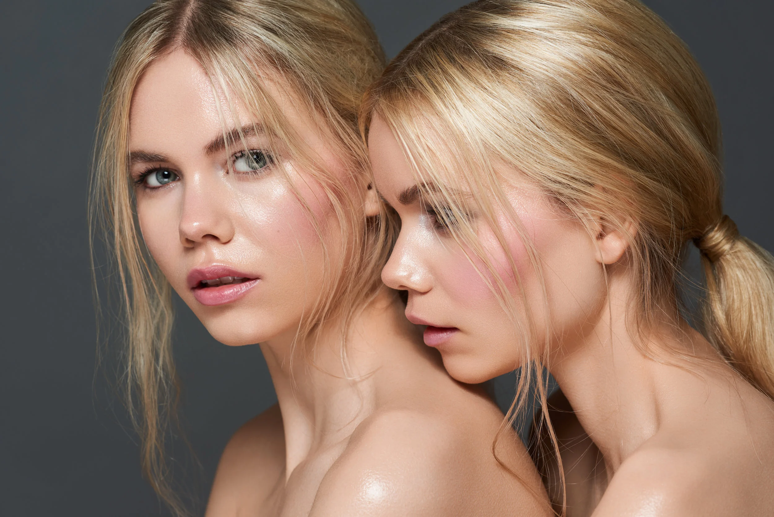 blonde twins with natural makeup modelling for beauty skincare shoot