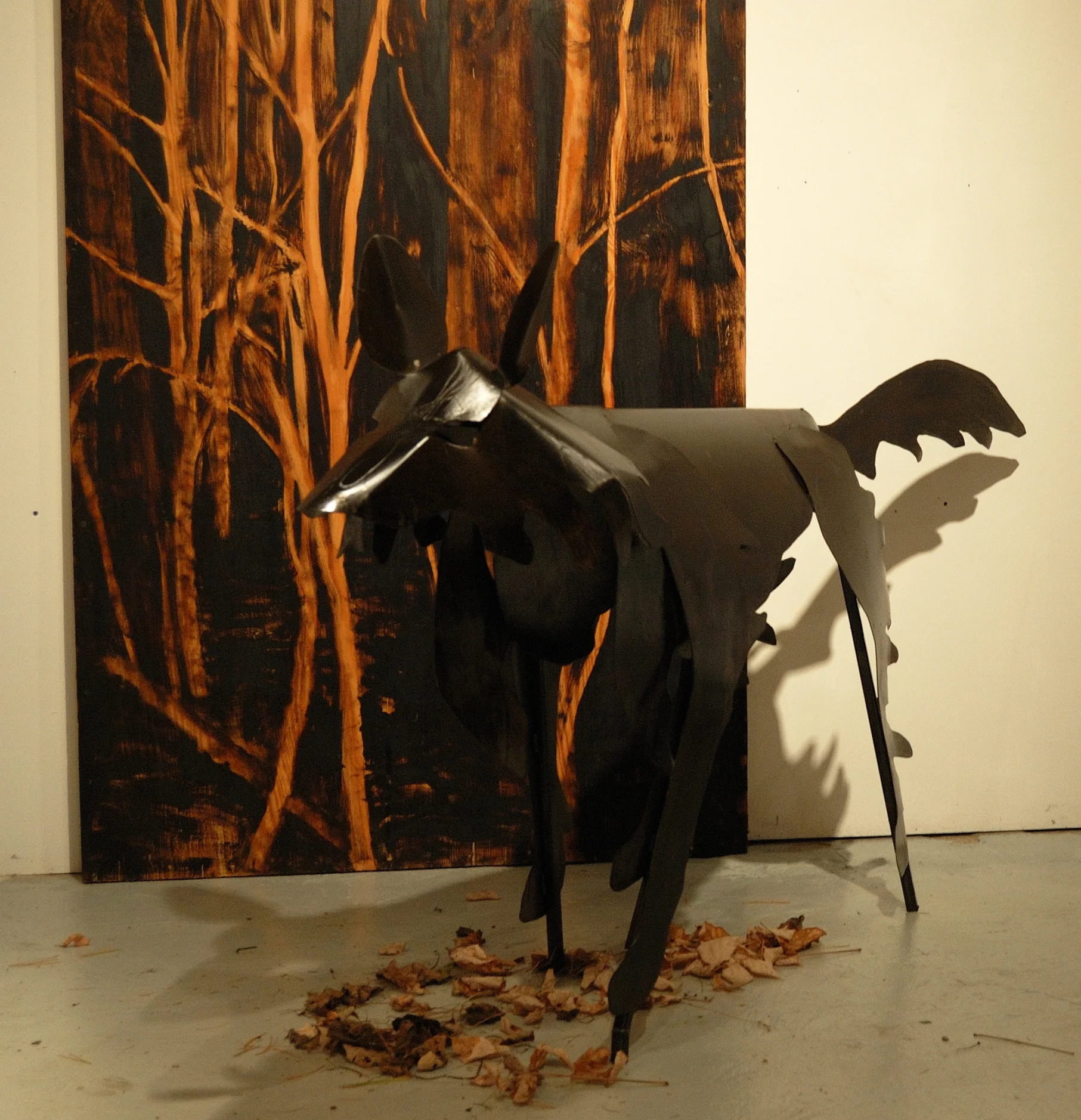 "Living Room" was a one-person show at Gallery 13, 811 LaSalle St., Minneapolis, MN.
The animals are life-size, Corten steel, the panels, both freestanding
and wall-hung, are each 4' x 8' plywood, painted in asphaltum. This is Grimm's Wolf in steel.